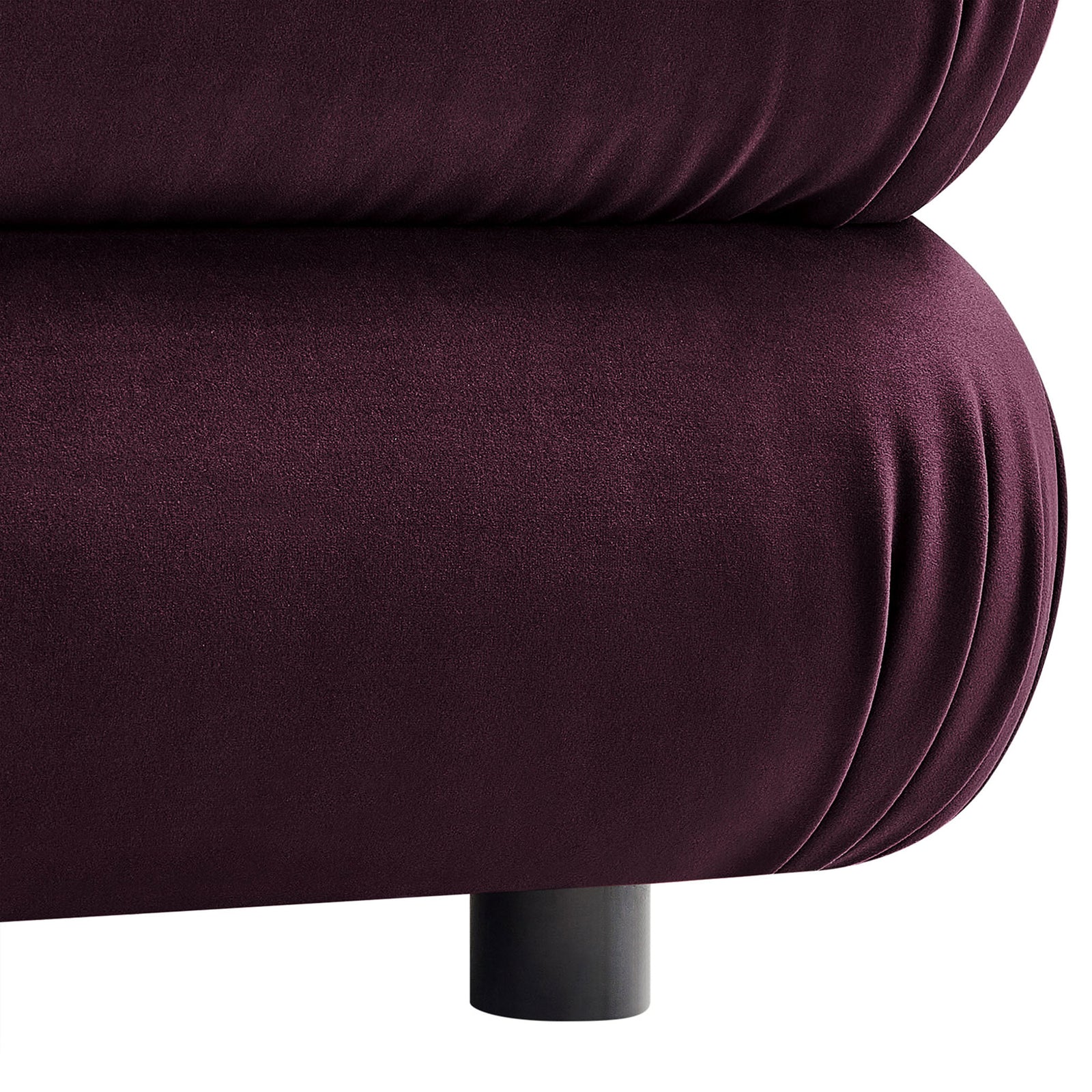 Close-up of the ottoman base highlighting the gathered velvet upholstery and low black support leg || EEI-6899-MUL || leg_studio