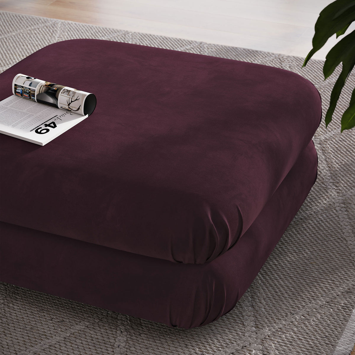 Mulberry performance velvet ottoman used as a soft coffee table on a textured area rug || EEI-6899-MUL || front_angle_room