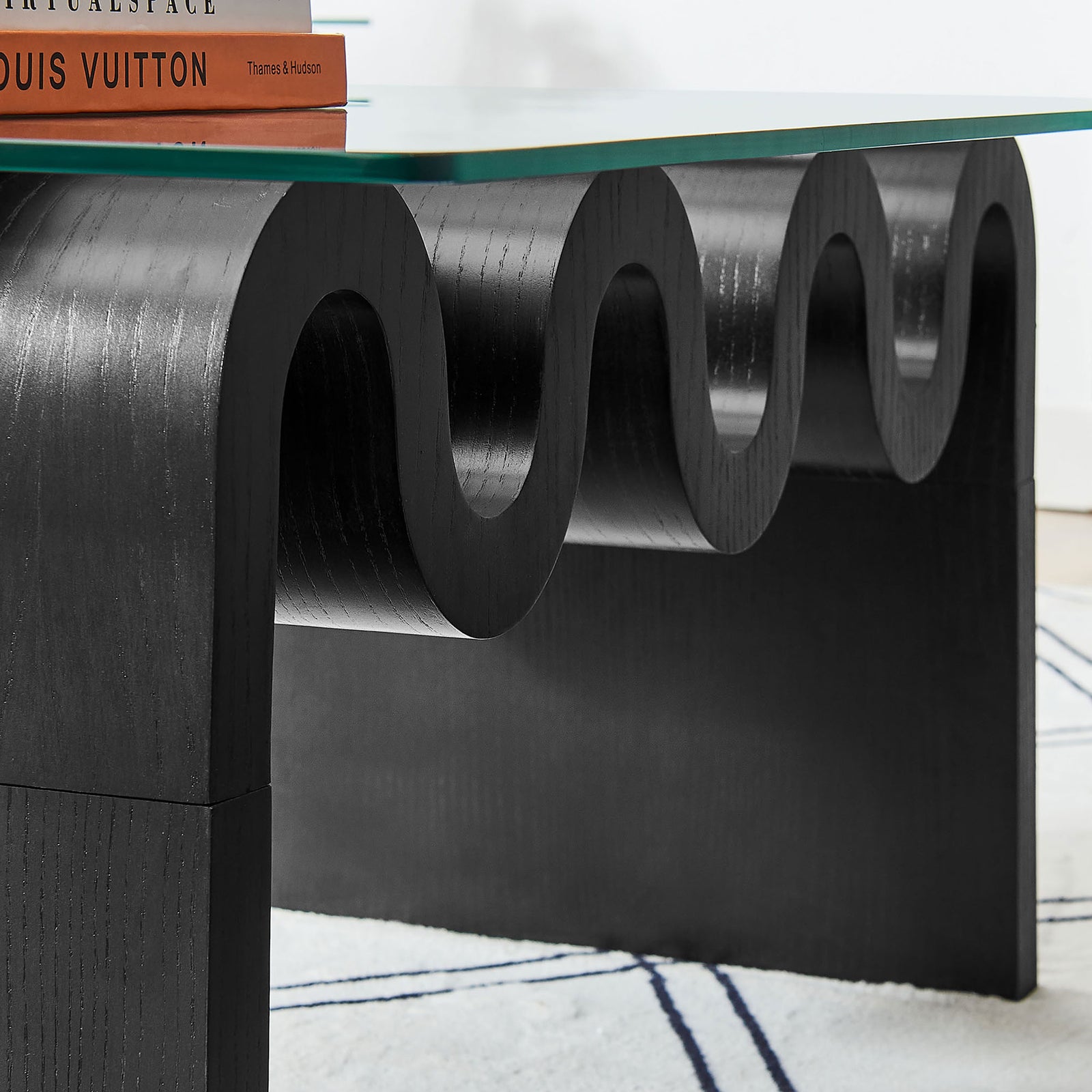 Wood grain finish highlights the swooping curves of the base for bold texture and depth. || EEI-6900-BLK || detail_room