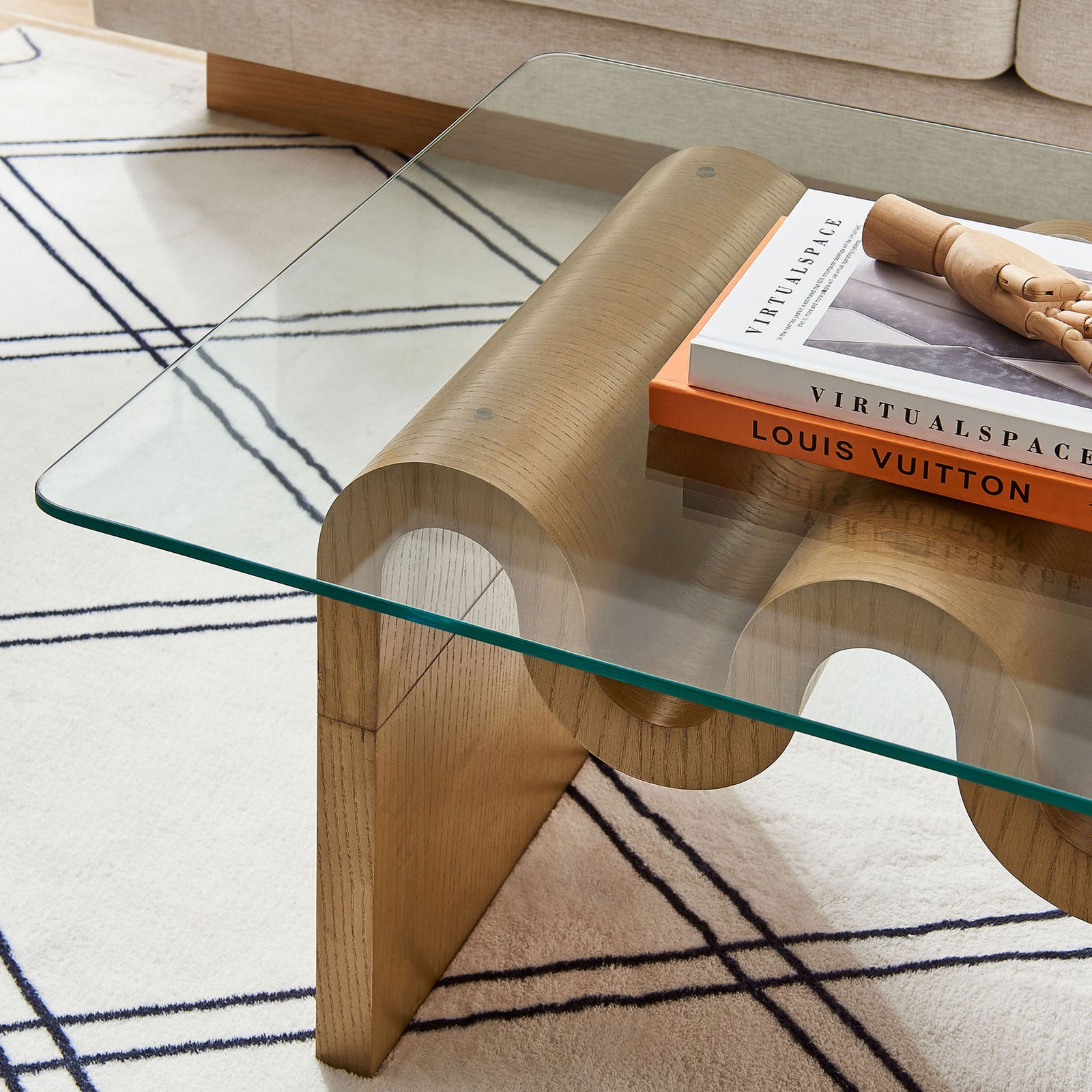 Glass top with rounded corners sits over a natural wave base, ideal for modern spaces || EEI-6900-NAT || detail_room