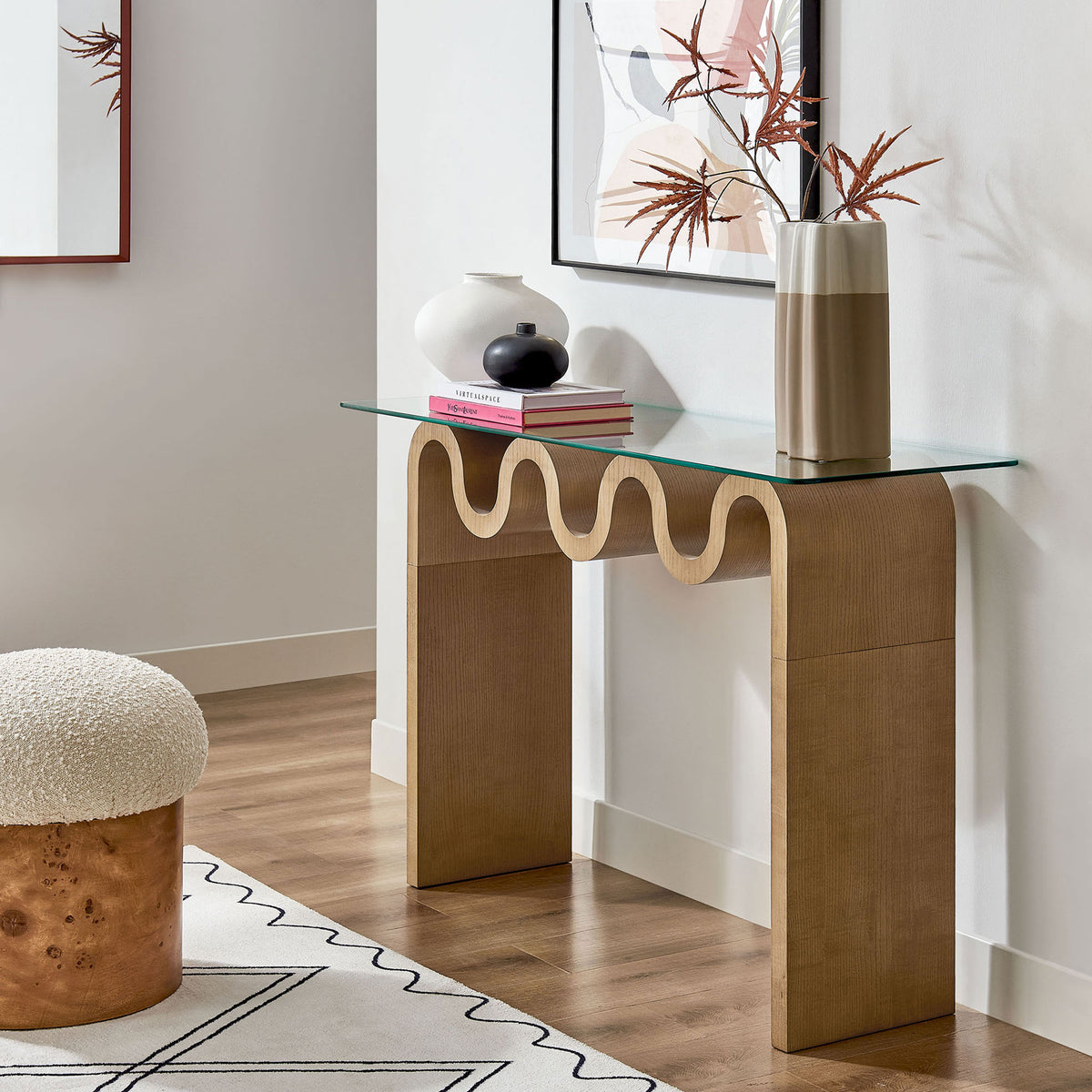 Console elevates an entry with a clear glass top and playful natural wood wave base. || EEI-6901-NAT || front_angle_room