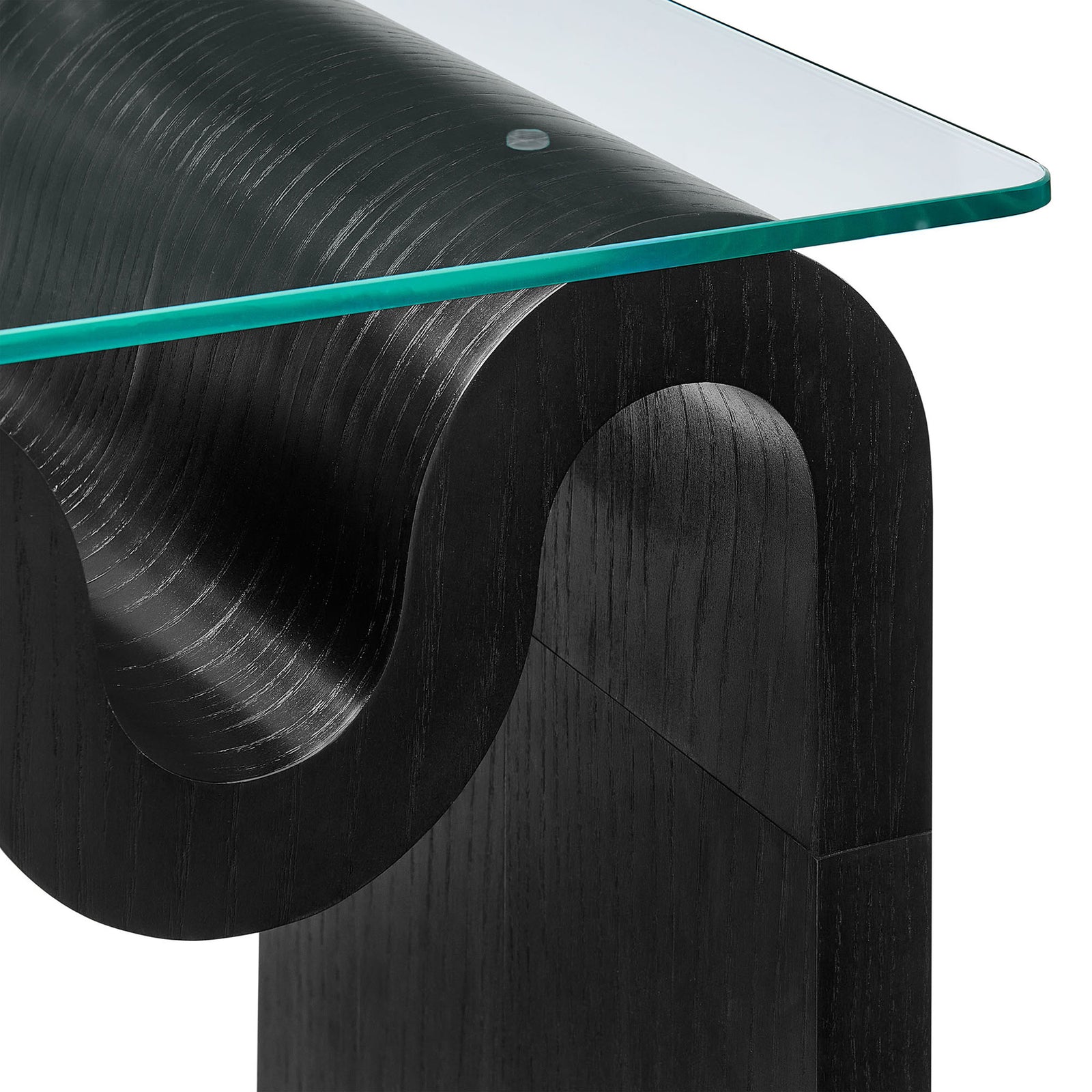 Detail of the Ondine table showing the rippled black wood grain and polished edge of the clear glass top || EEI-6902-BLK || detail_studio