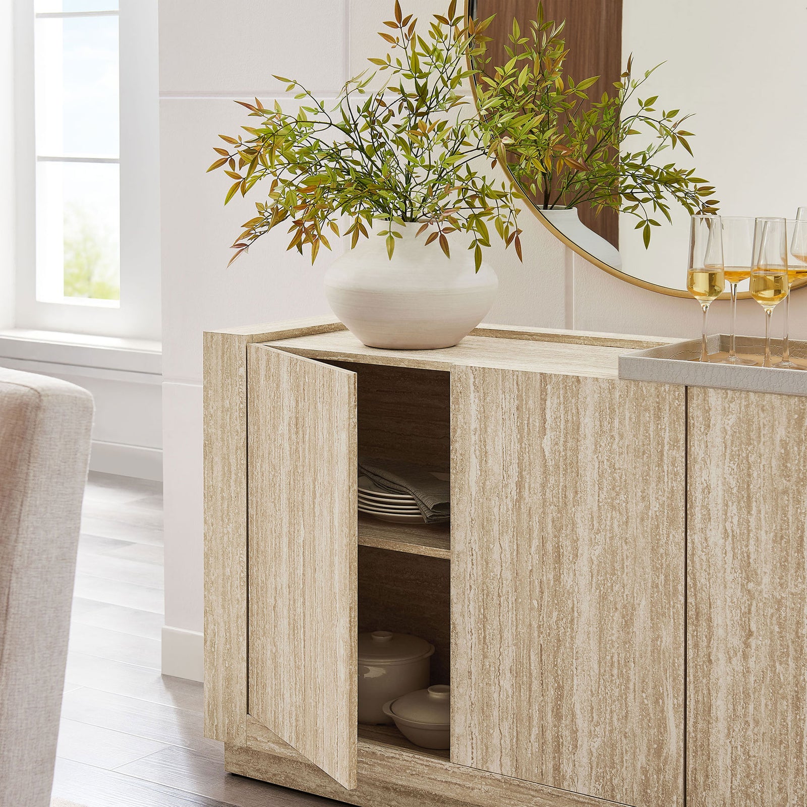 Sideboard used as a buffet, with one door open to display neatly organized dinnerware || EEI-6906-TRA || storage_open_room