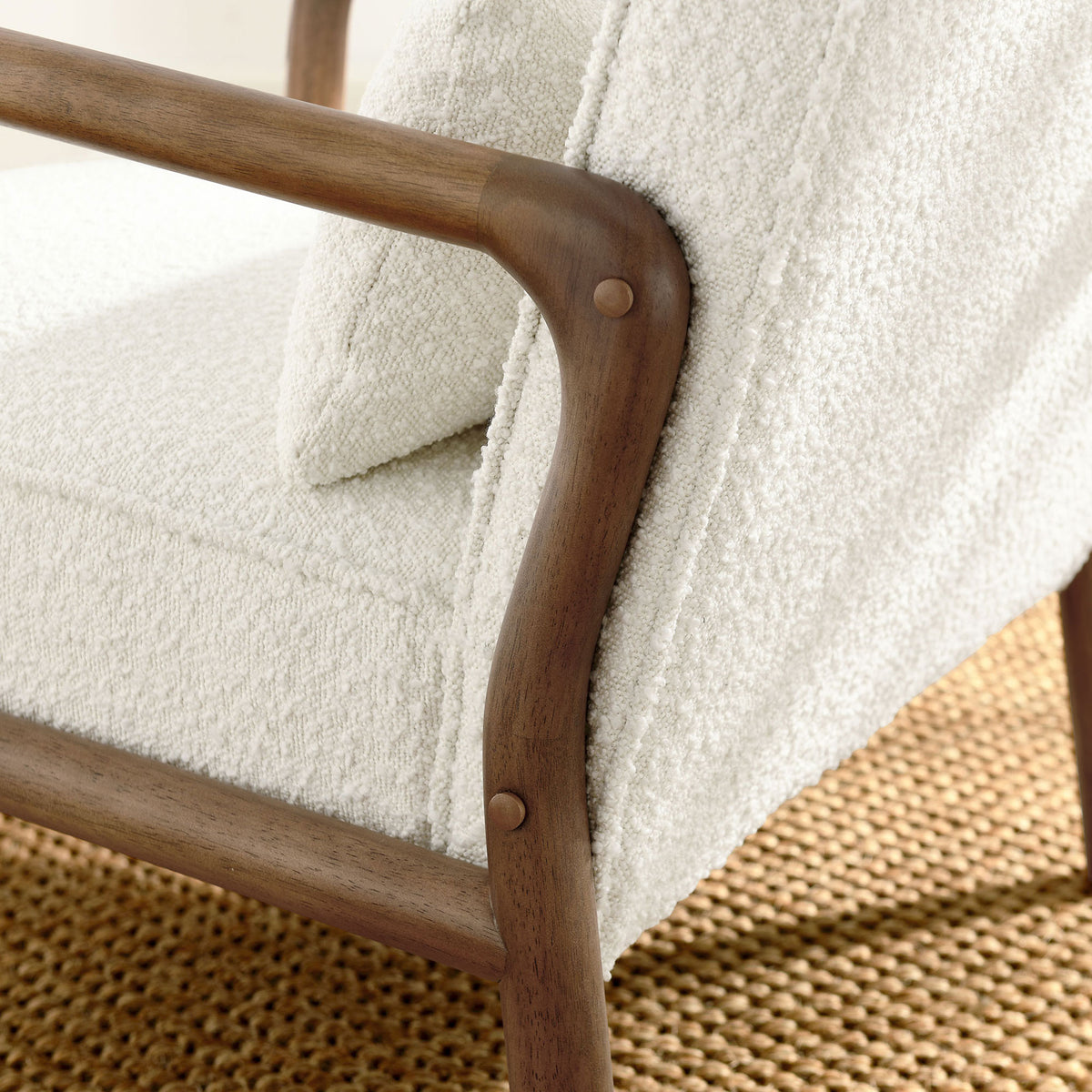Warm wood arm and boucle upholstery with neat seams elevate everyday comfort || EEI-6909-IVO || detail_room