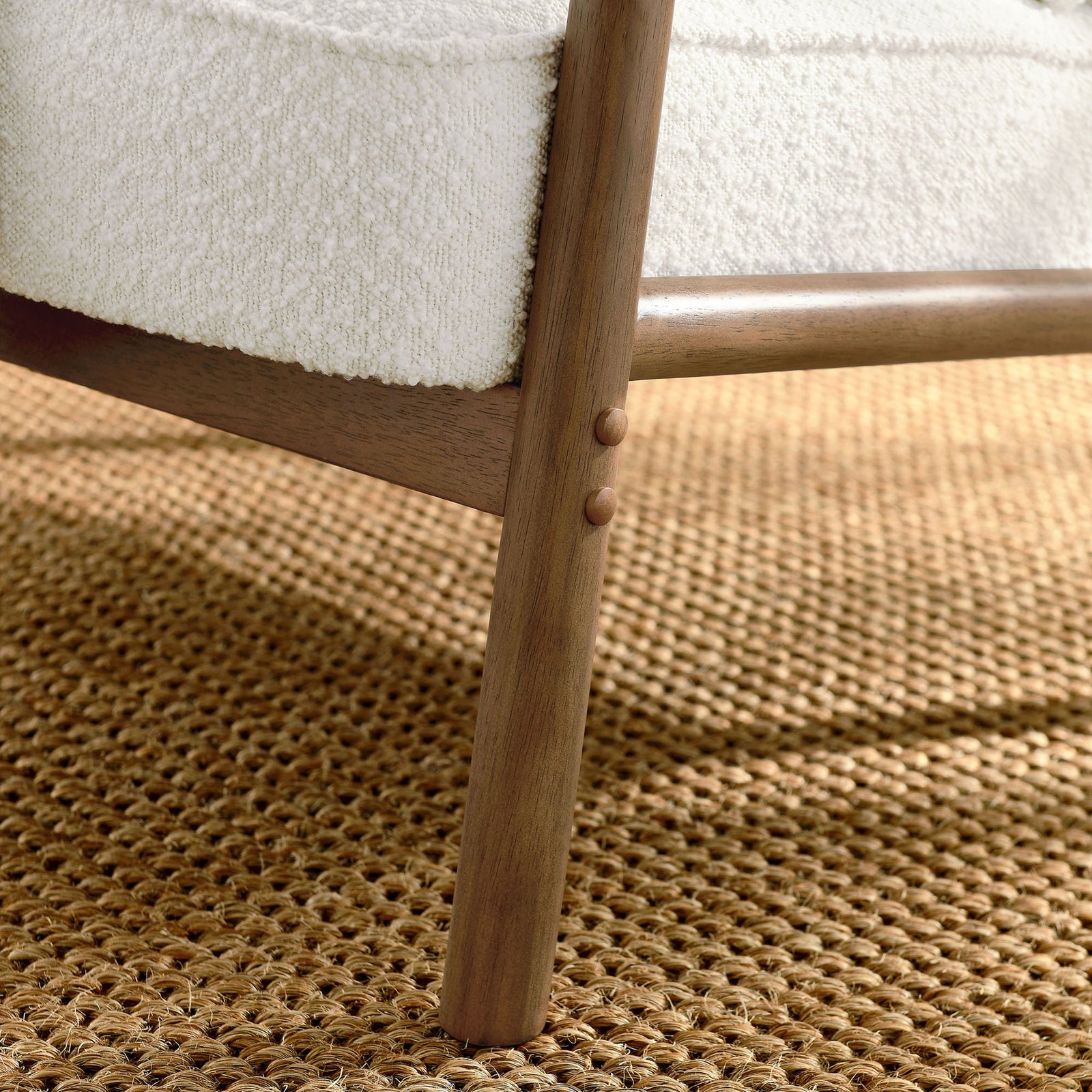 Sturdy wood leg with rounded profile and dowel accents supports the plush seat || EEI-6909-IVO || leg_room