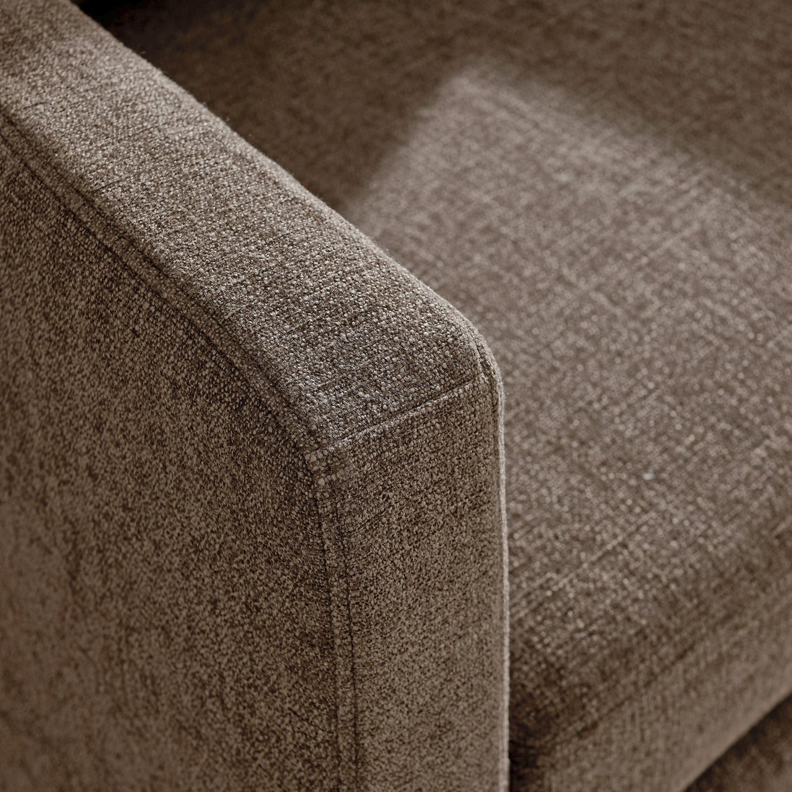 Textured mocha upholstery with refined stitched edging at the arm || EEI-6910-MOC || detail_studio