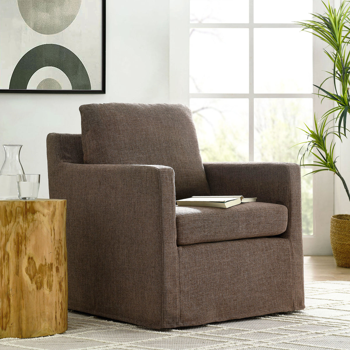 Cozy swivel armchair in mocha fabric elevates a bright, modern living space || EEI-6910-MOC || front_angle_room