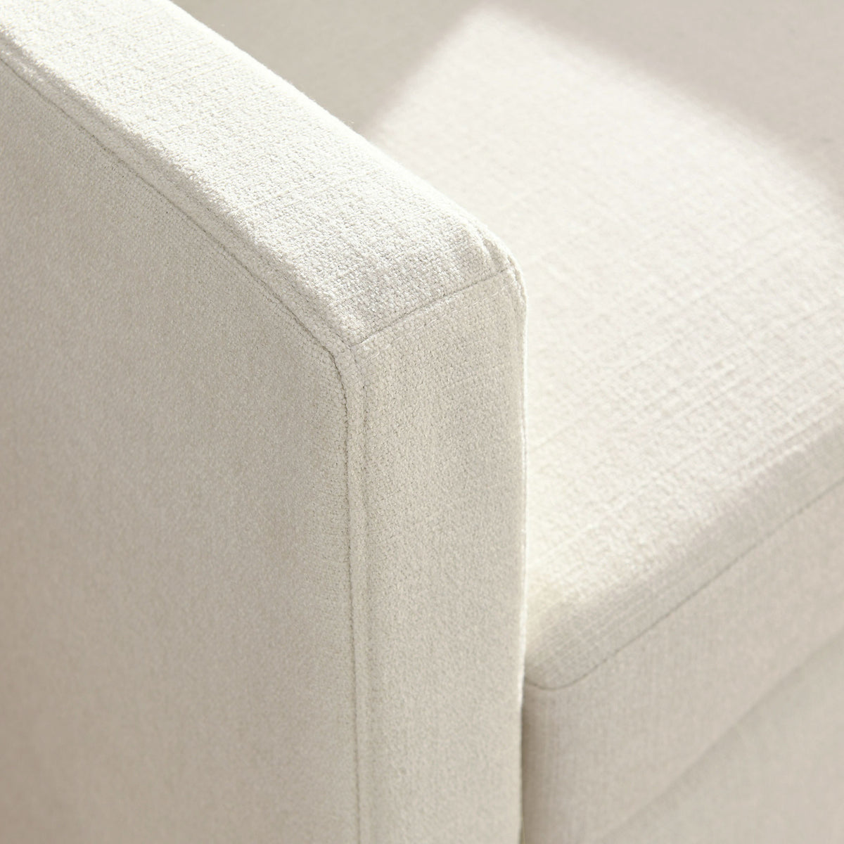 Tailored seams and softly textured fabric elevate the arm and seat details || EEI-6910-SAL || detail_studio