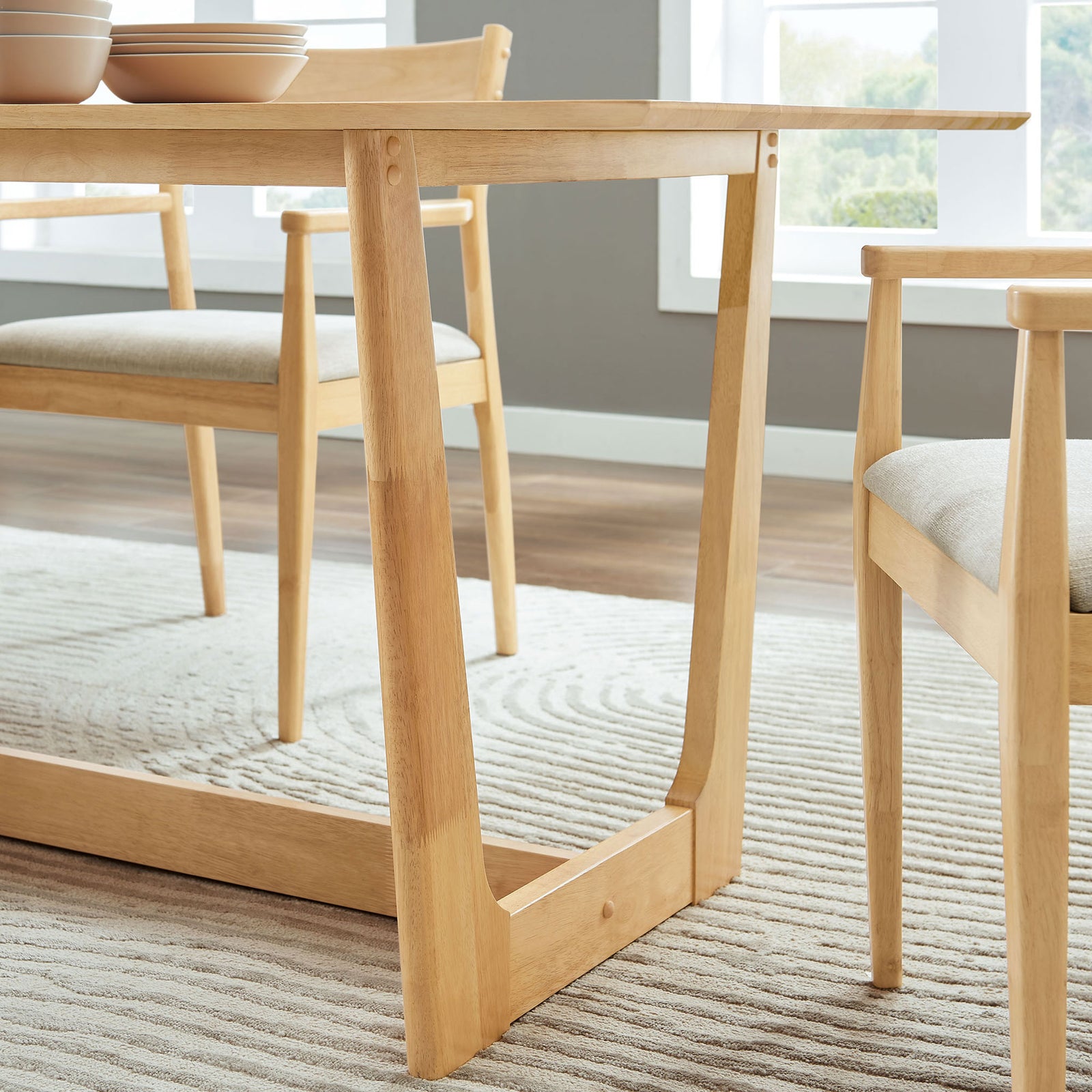 Dining table leg and stretcher create an open base that keeps the room feeling spacious || EEI-6914-NAT || leg_room