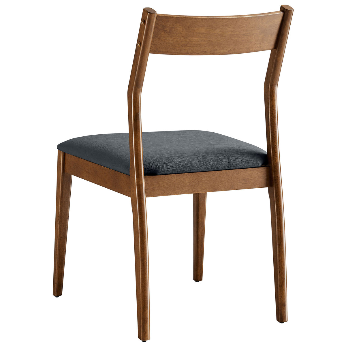 Walnut dining chair with sculpted backrest and clean-lined frame in a mid-century silhouette. || EEI-6917-WAL-BLK || back_angle_studio