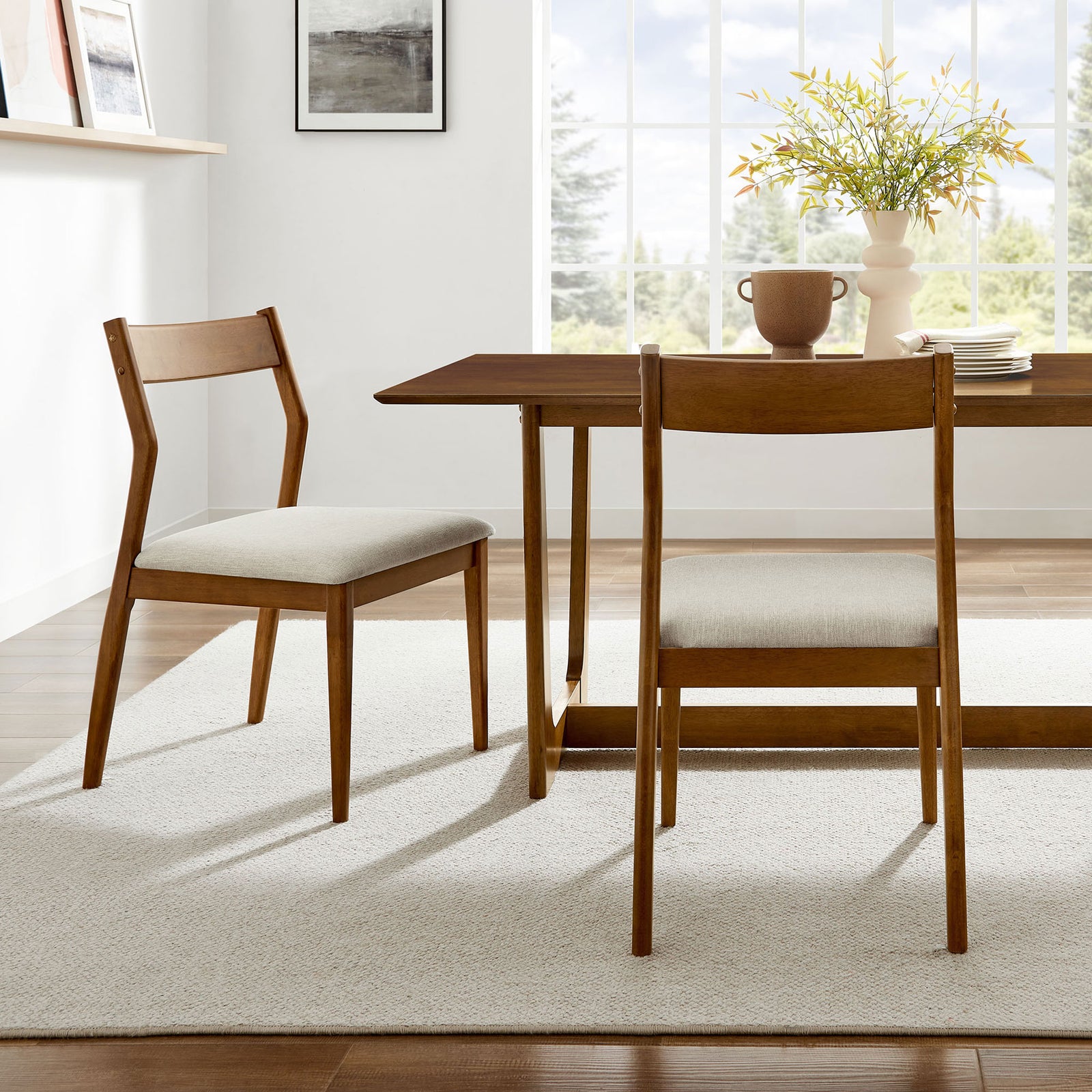 Set of two walnut dining chairs around a matching table for an inviting, airy dining room || EEI-6918-WAL-HEB || side_multi_room