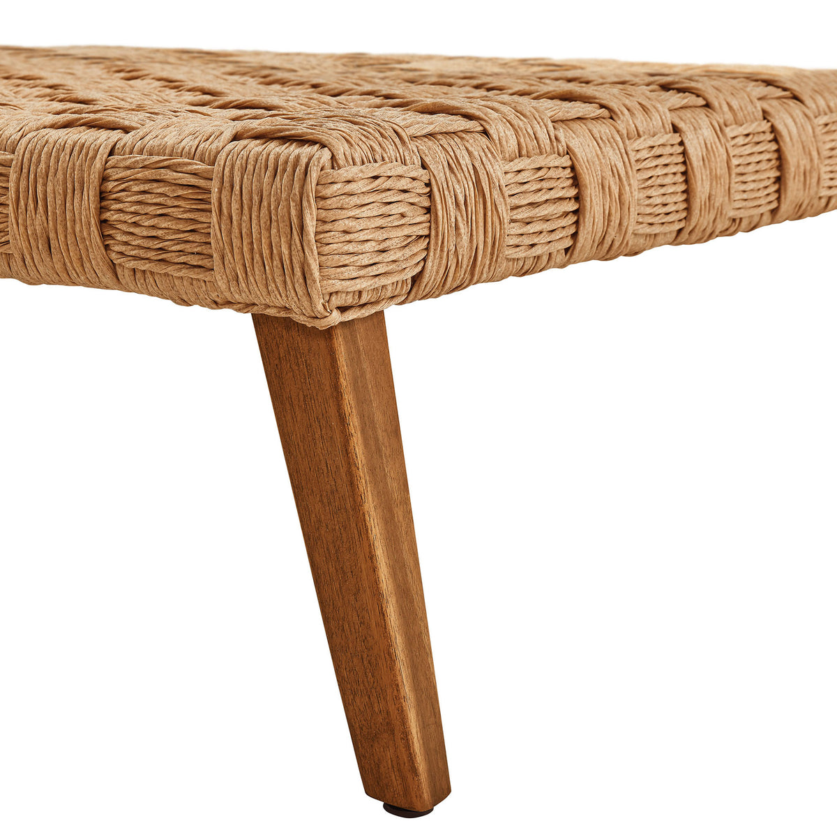 Detail of tapered acacia wood leg and wrapped rattan edge for a refined outdoor coffee table finish || EEI-6926-NAT || leg_studio