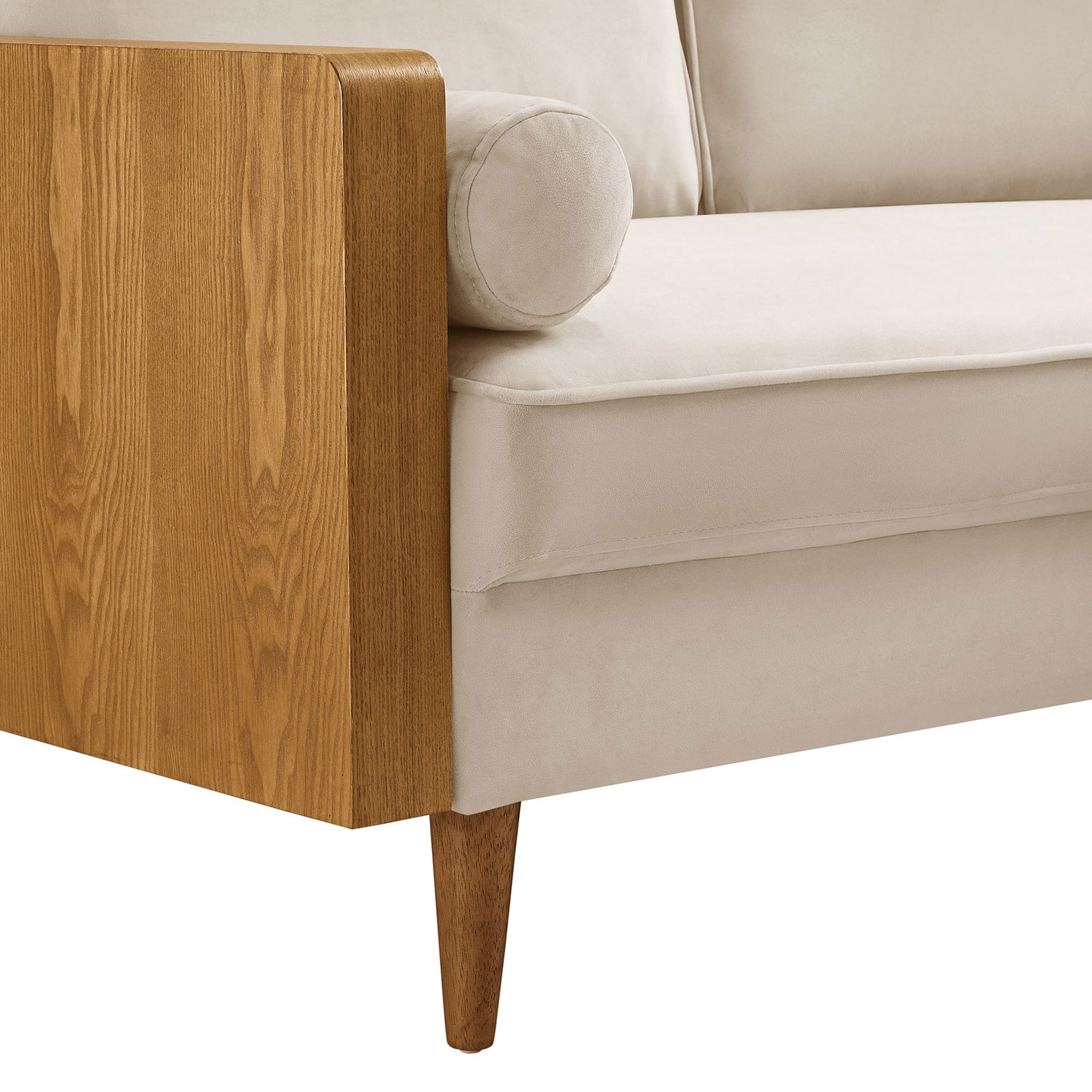Velvet seat cushion with rounded arm edge and tapered wood leg detail || EEI-6945-WAL-ALM || detail_studio