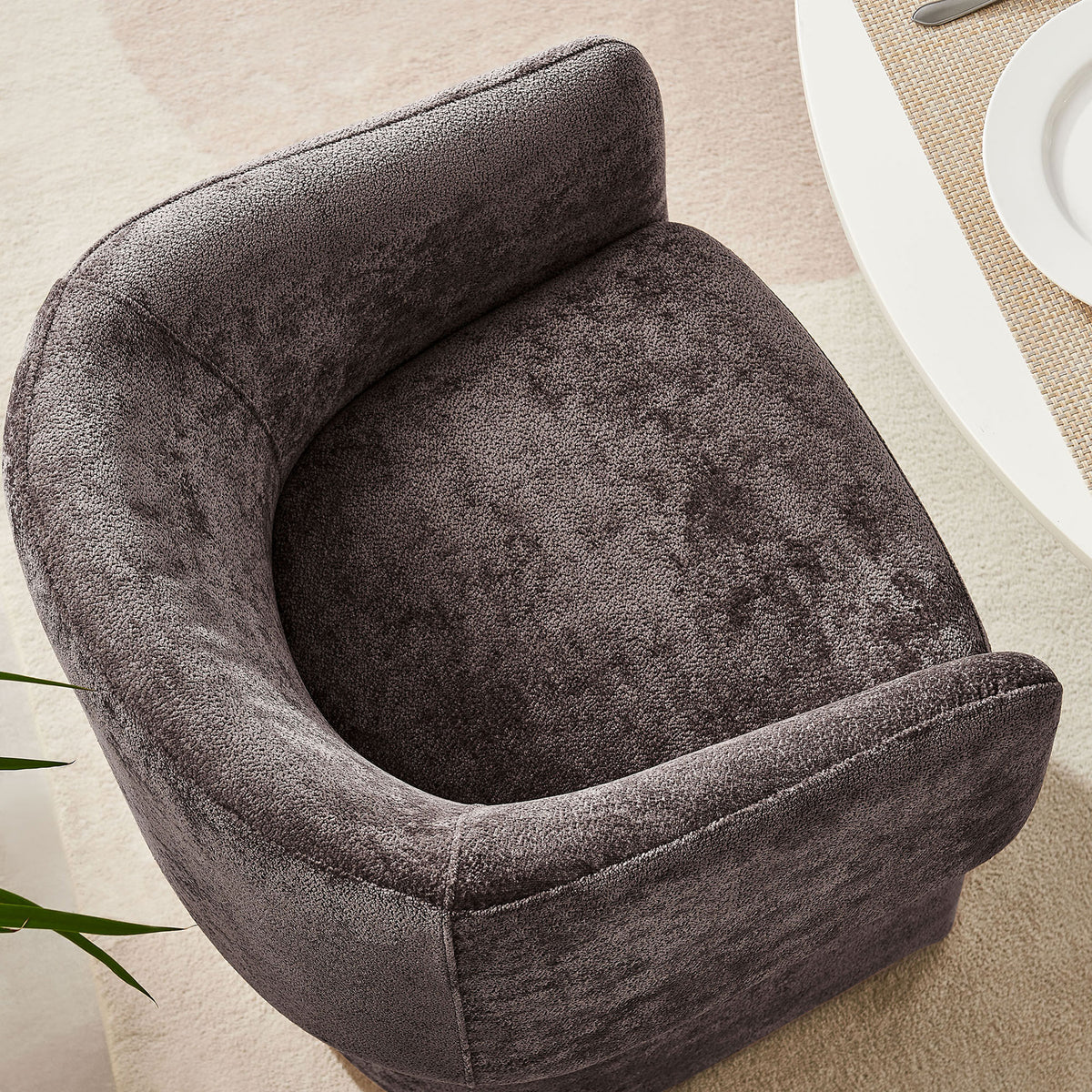 Curved barrel back dining chair with rounded seat and continuous backrest, styled beside a soft neutral rug. || EEI-6951-CHB || top_room
