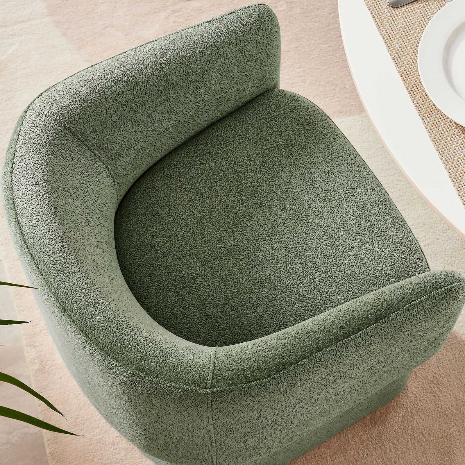 Overhead look at sage chenille barrel chair tucked beside a dining table on a soft neutral rug || EEI-6951-SGE || top_room