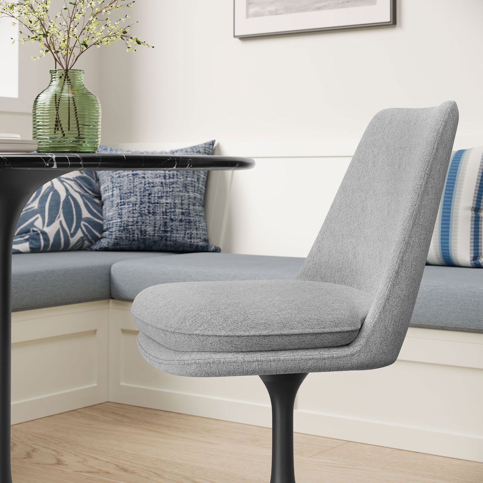 Gray pedestal-base chair tucked at a cozy breakfast nook beside white built-in bench seating || EEI-6953-BLK-HLG || front_angle_room