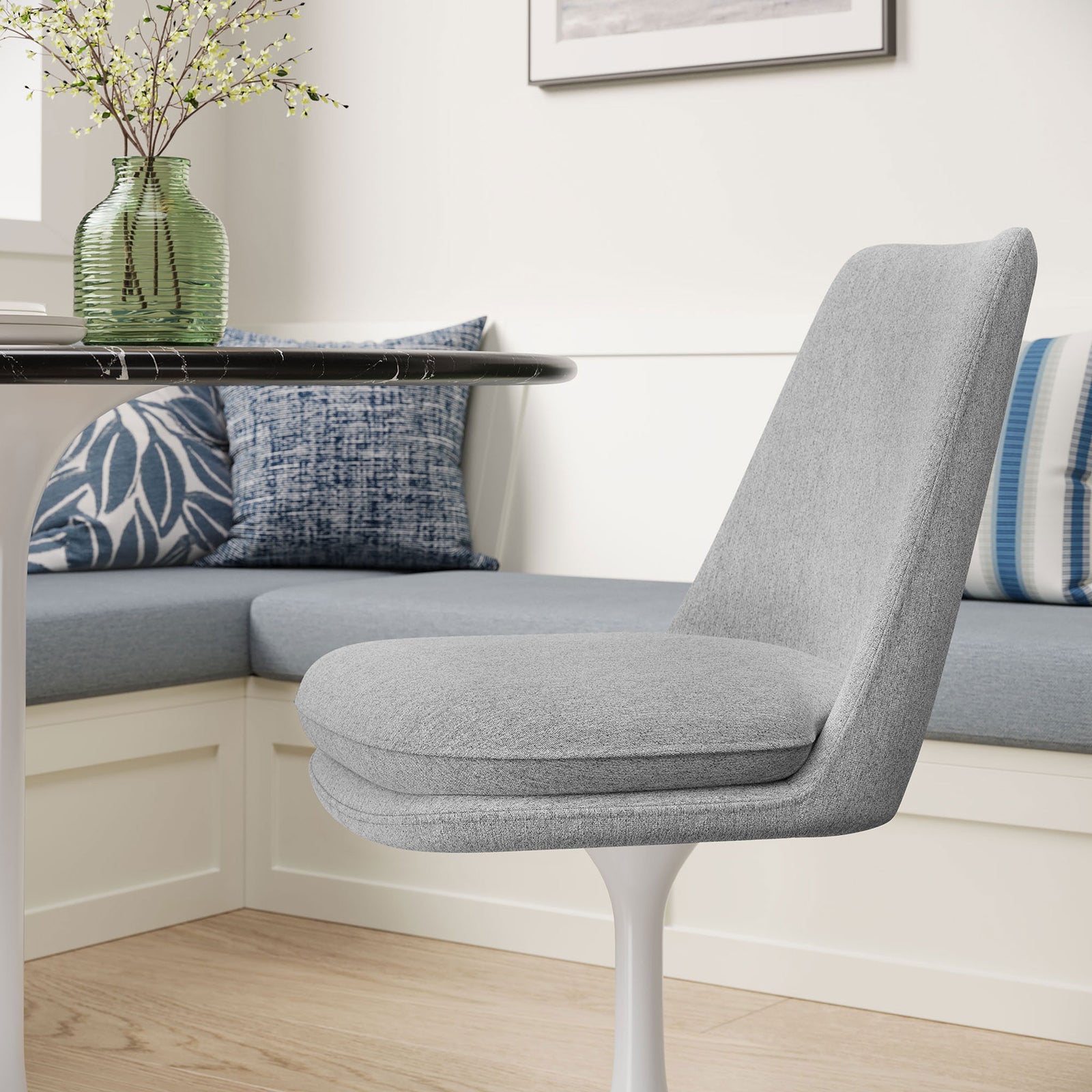 Light gray upholstered pedestal chair tucked at a cozy breakfast nook with blue accent cushions || EEI-6953-WHI-HLG || detail_room