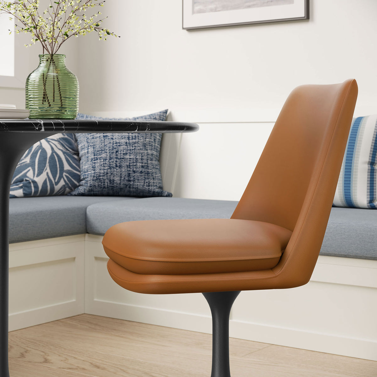Tan vegan leather Lippa swivel chair beside a cozy banquette, showcasing its thick cushioned seat and slim pedestal || EEI-6955-BLK-TAN || side_room
