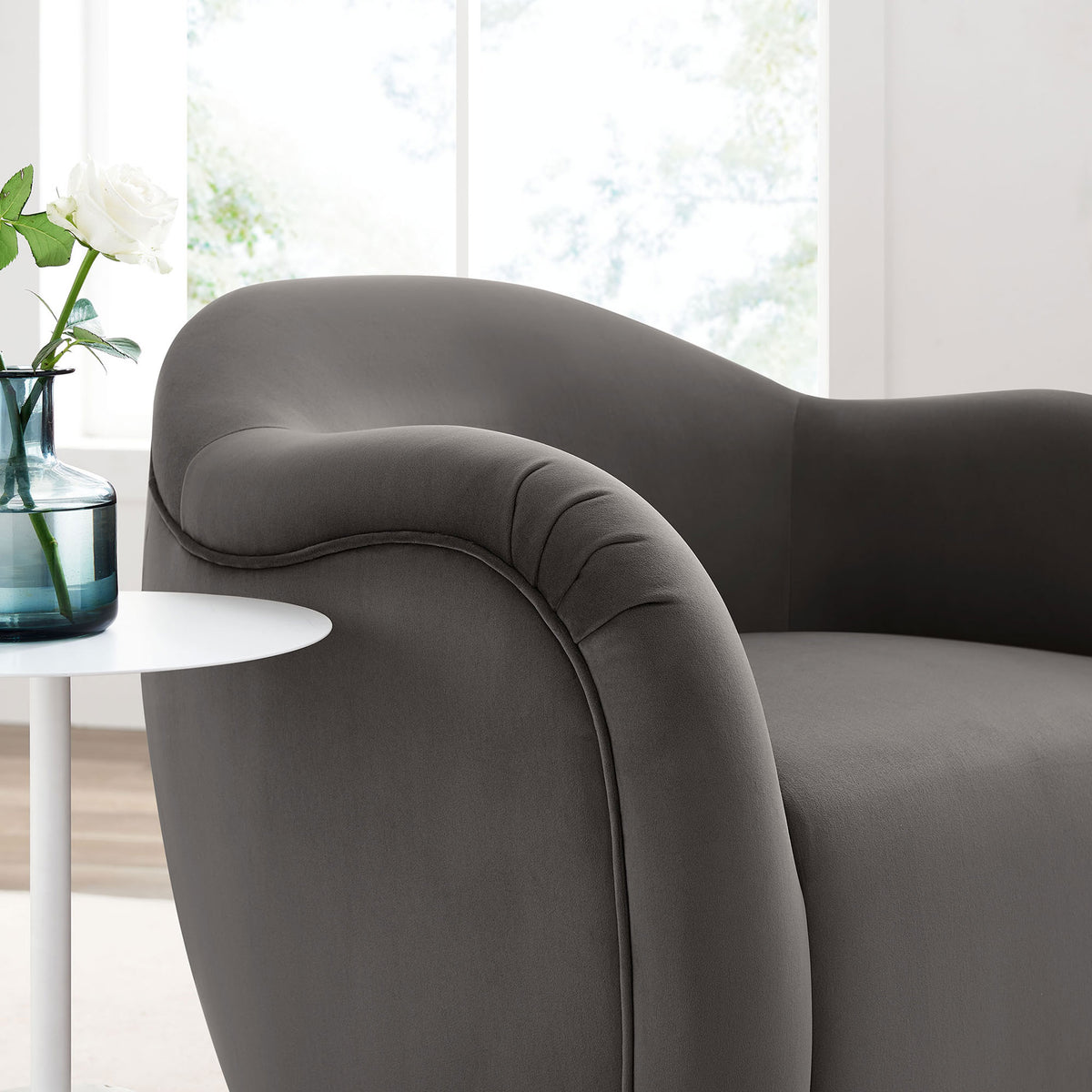 Velvet upholstery and tailored seams add a soft, inviting touch to the arm and backrest || EEI-6959-STG || detail_room