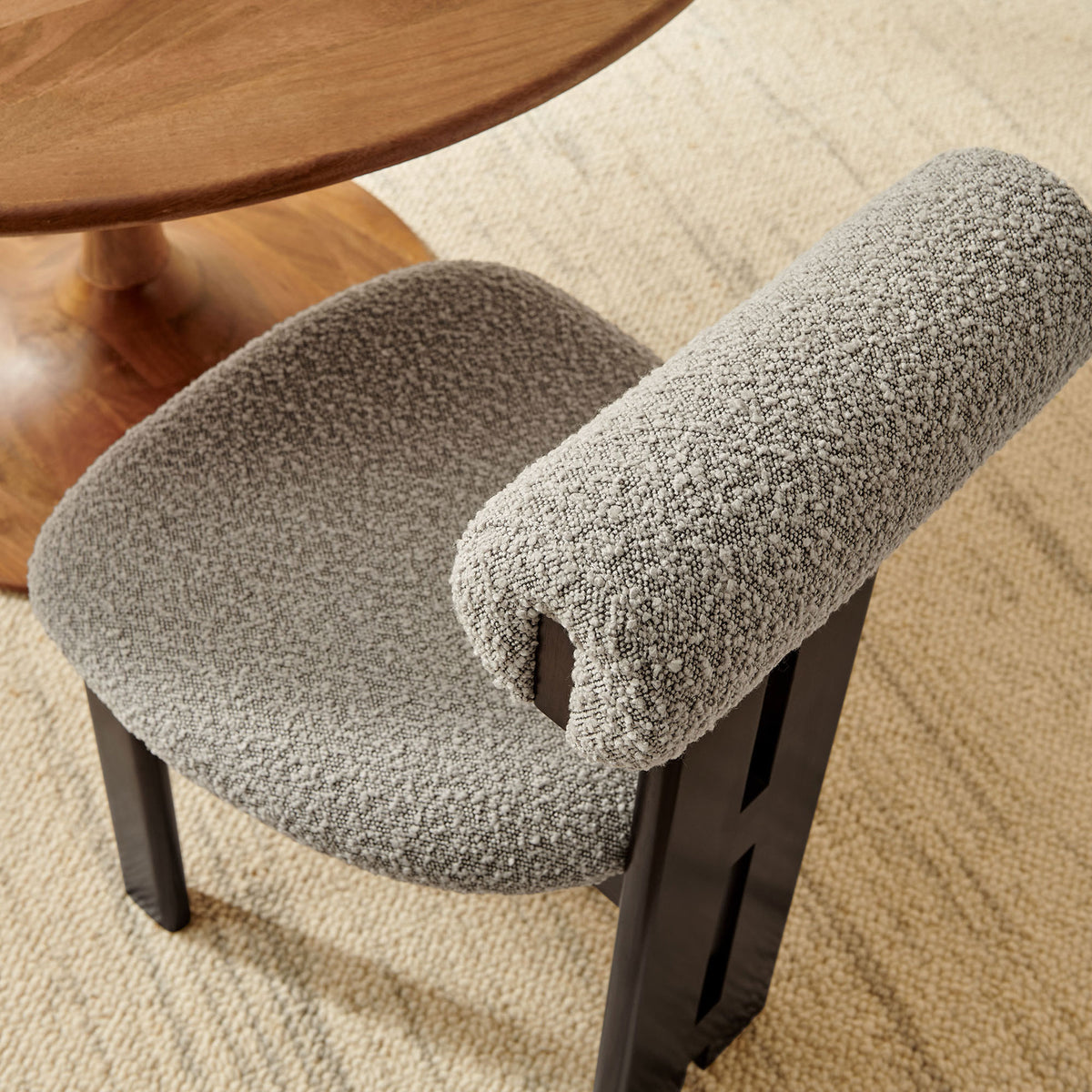 Taupe boucle dining chair styled by a round wood table and neutral rug for a soft, textural dining look. || EEI-6960-WEN-TAU || detail_room