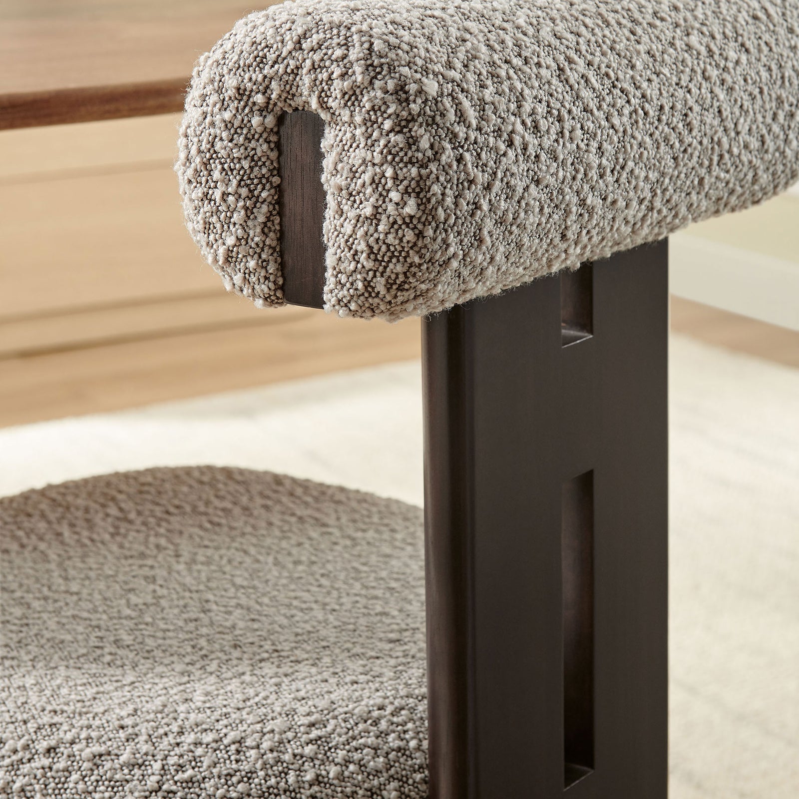 Textured taupe boucle roll-back cushion and cutout wenge support bring artisanal detail to this dining chair. || EEI-6960-WEN-TAU || detail_room