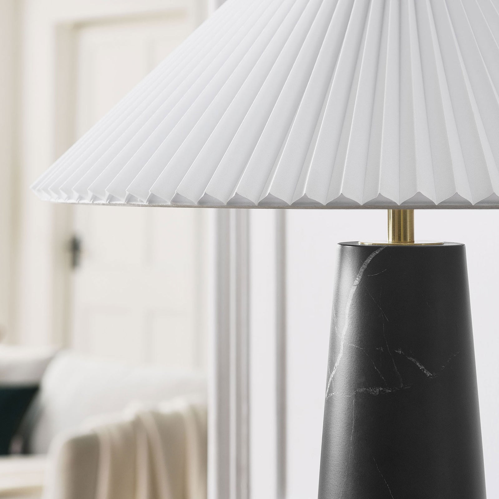 Nera black marble table lamp adding refined contrast to a light, neutral living space. || EEI-6963-BLK || detail_room