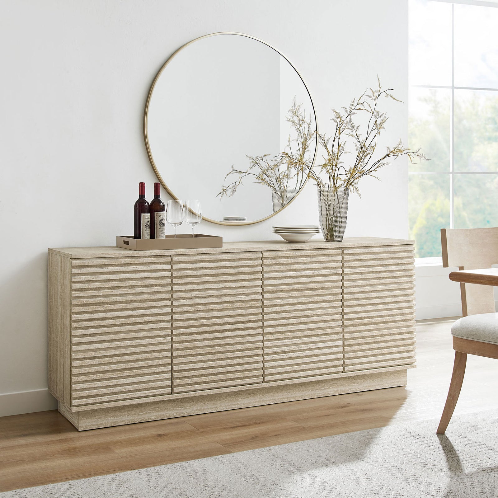 Render sideboard in a modern dining space styled with mirror, vases, and wine for an inviting look || EEI-6966-TRA || front_angle_room