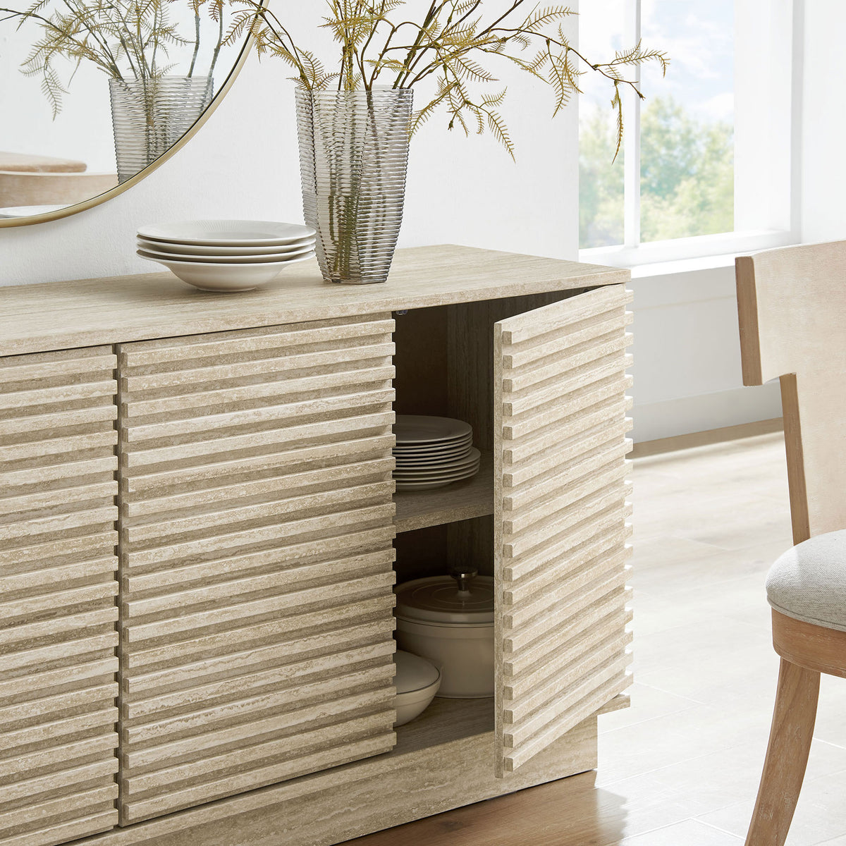 Close up of open cabinet door in styled room scene showing dishes neatly stored behind slatted front || EEI-6966-TRA || storage_open_room