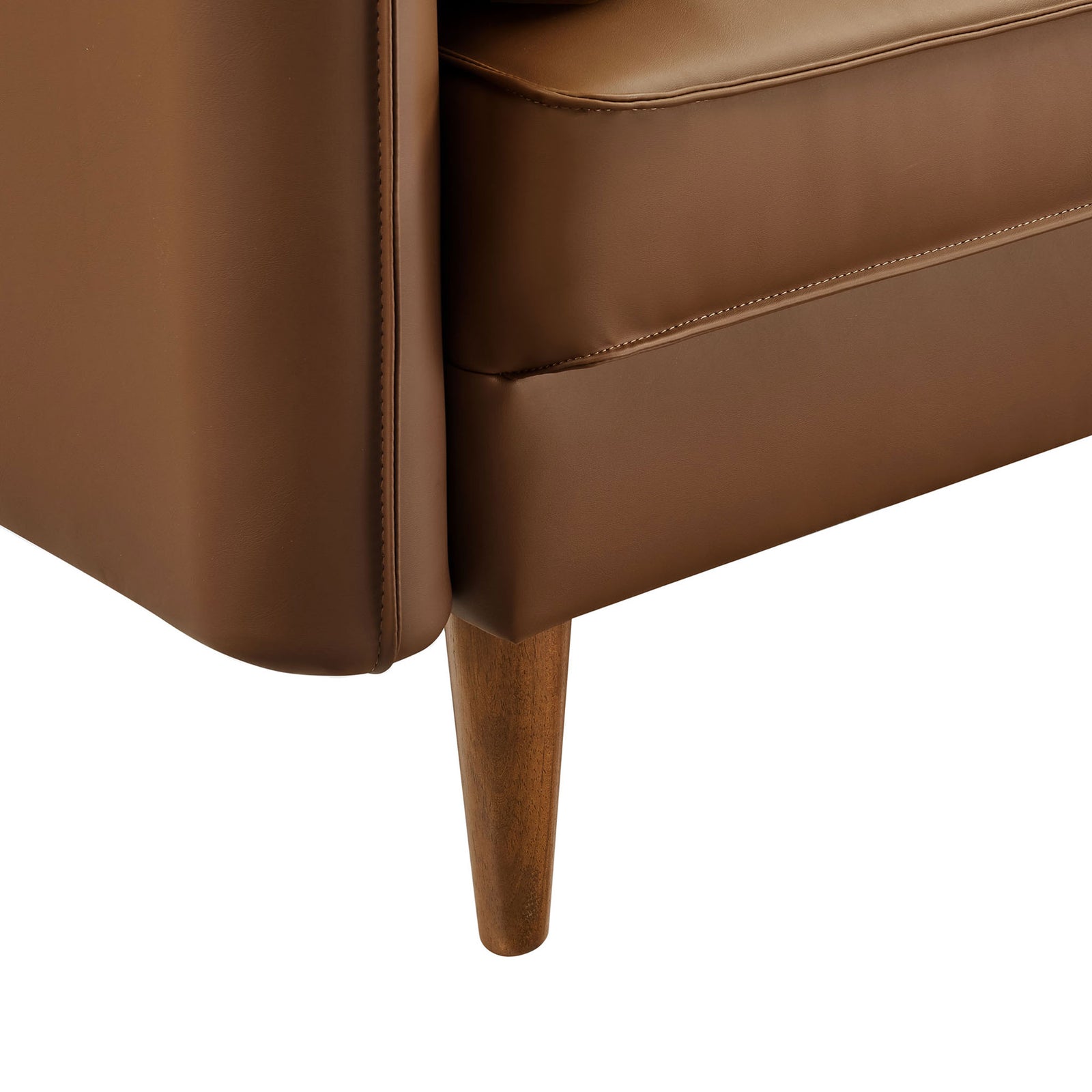 Tapered wood leg and neatly tailored base supporting the brown vegan leather sofa. || EEI-6975-BRN || leg_studio