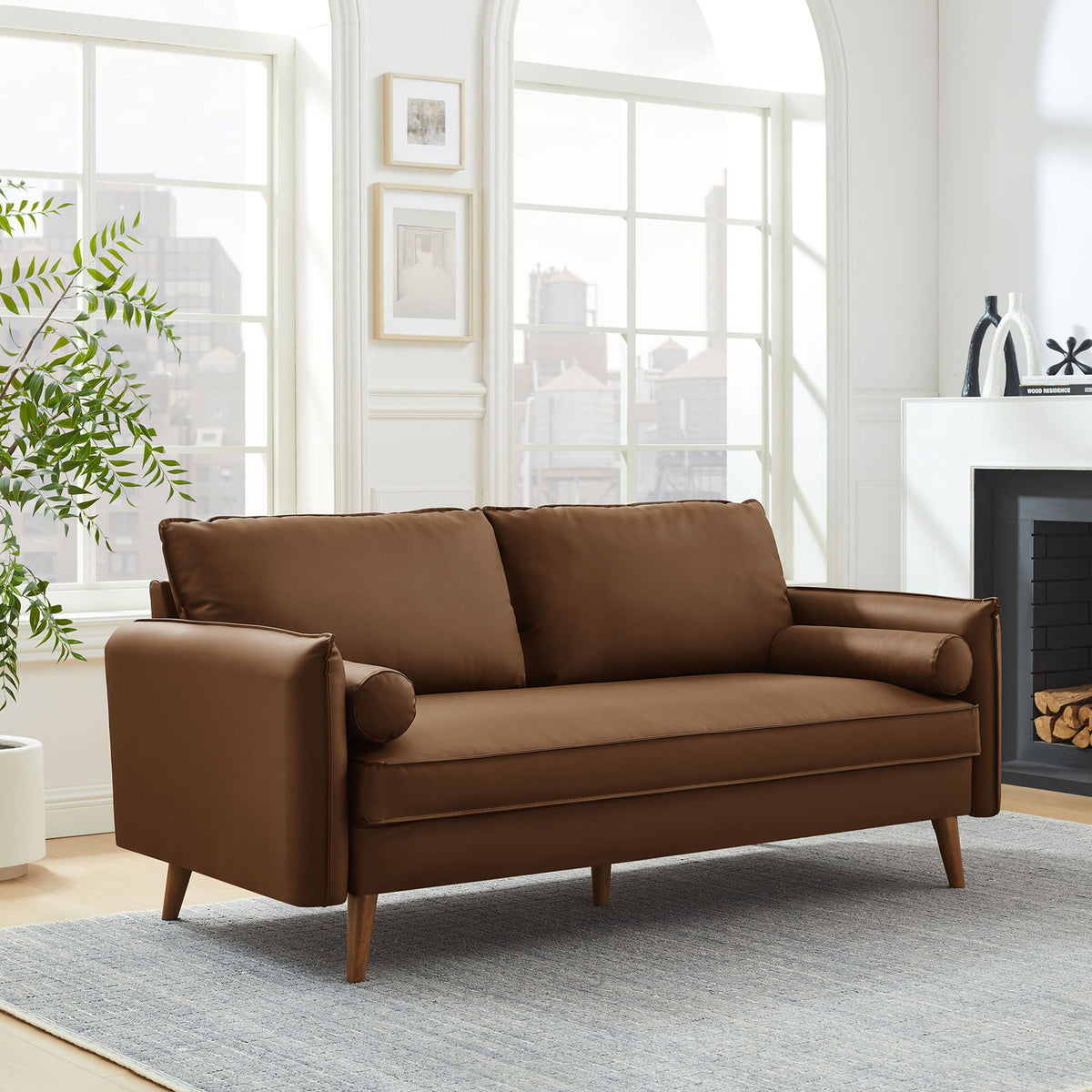 Brown vegan leather sofa bringing mid-century warmth to a bright, airy living room. || EEI-6975-BRN || front_angle_room