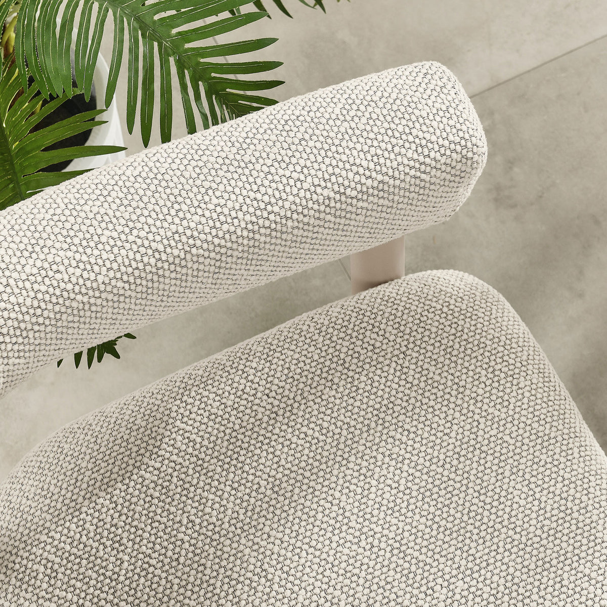 Ivory seat and arm cushions contrasted with a taupe frame above a smooth tiled patio floor || EEI-6979-IVO-TAU || detail_room