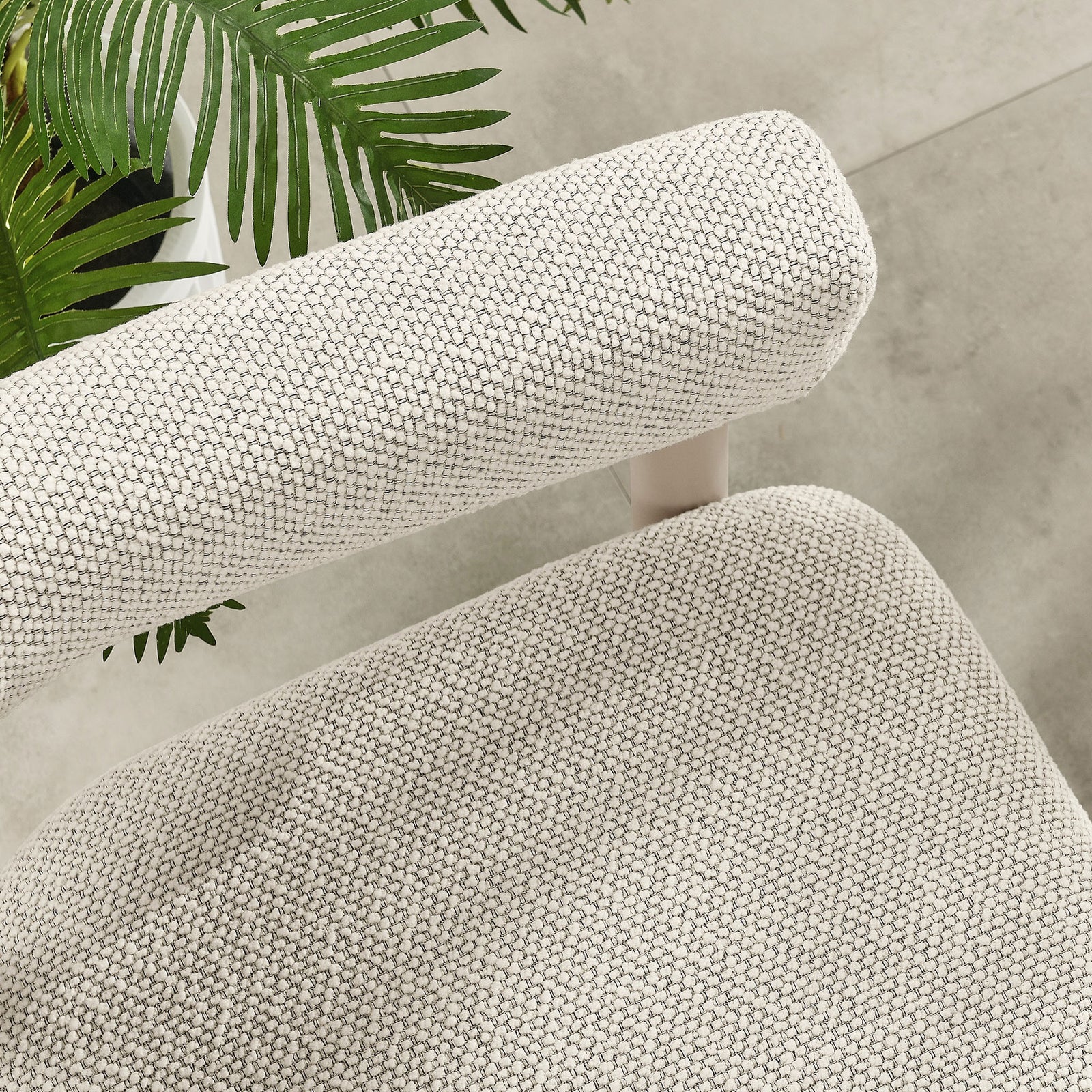 Ivory seat and arm cushions contrasted with a taupe frame above a smooth tiled patio floor || EEI-6979-IVO-TAU || detail_room