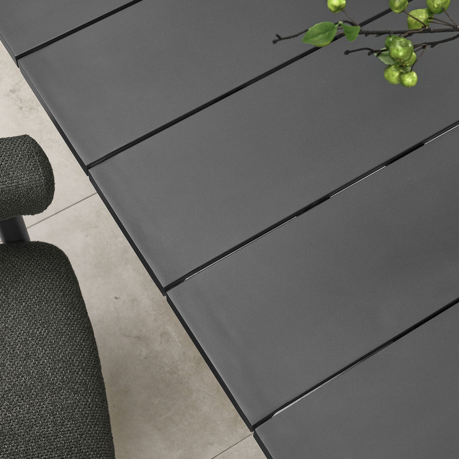 Graphite slatted tabletop with subtle sheen, styled with greenery and decor on a stone tiled patio || EEI-6980-GPH || detail_room