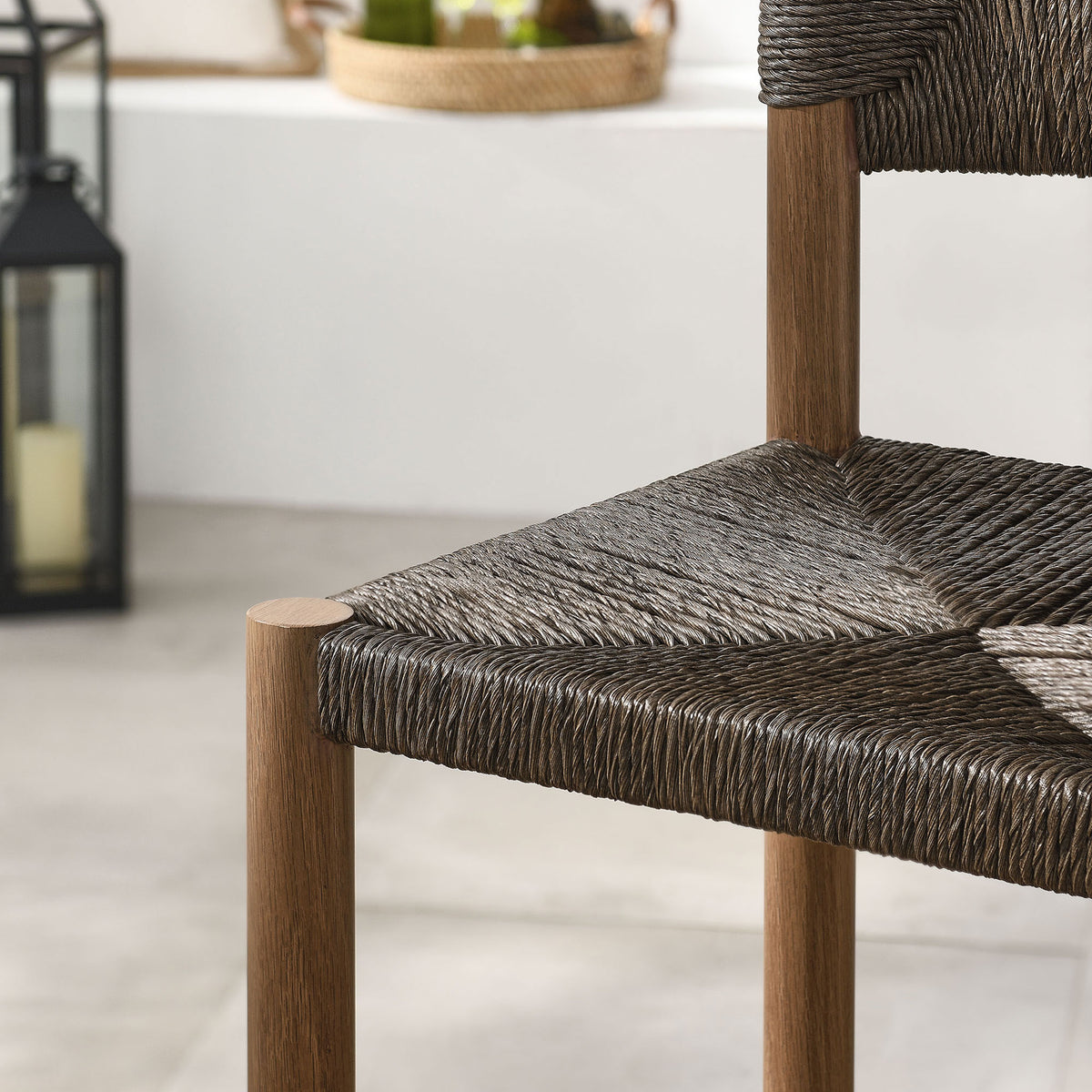 Dark rattan seat pattern contrasts with the light deck for a striking outdoor accent || EEI-6983-WAL || swatch_room