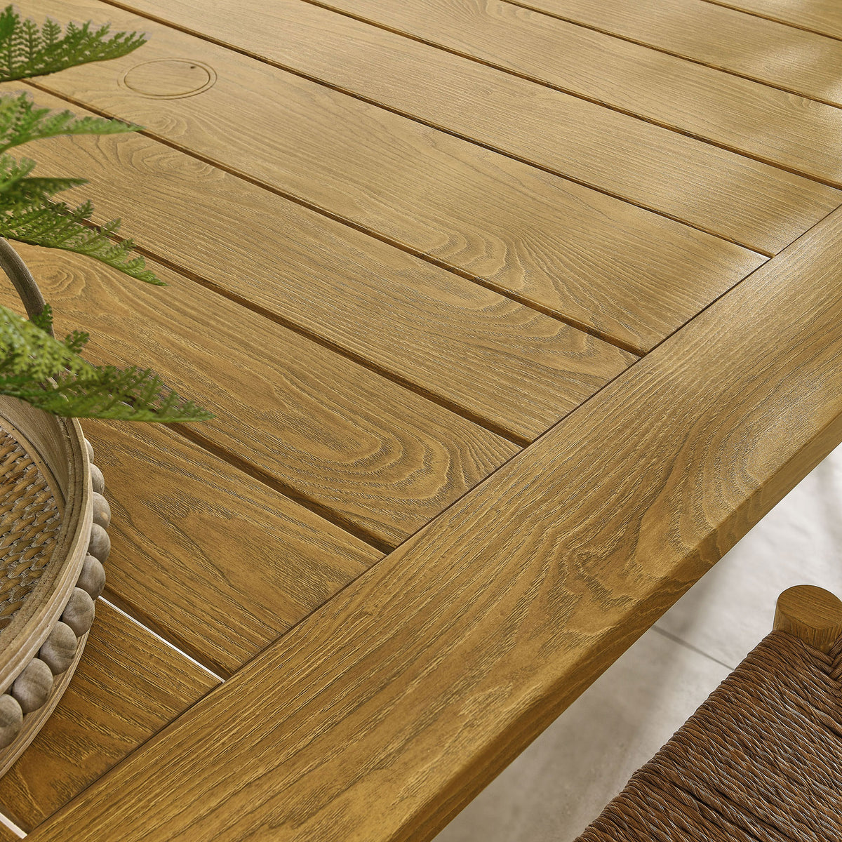 Warm natural wood-grain slats pair with woven seating and greenery for inviting patio style || EEI-6985-NAT || swatch_room