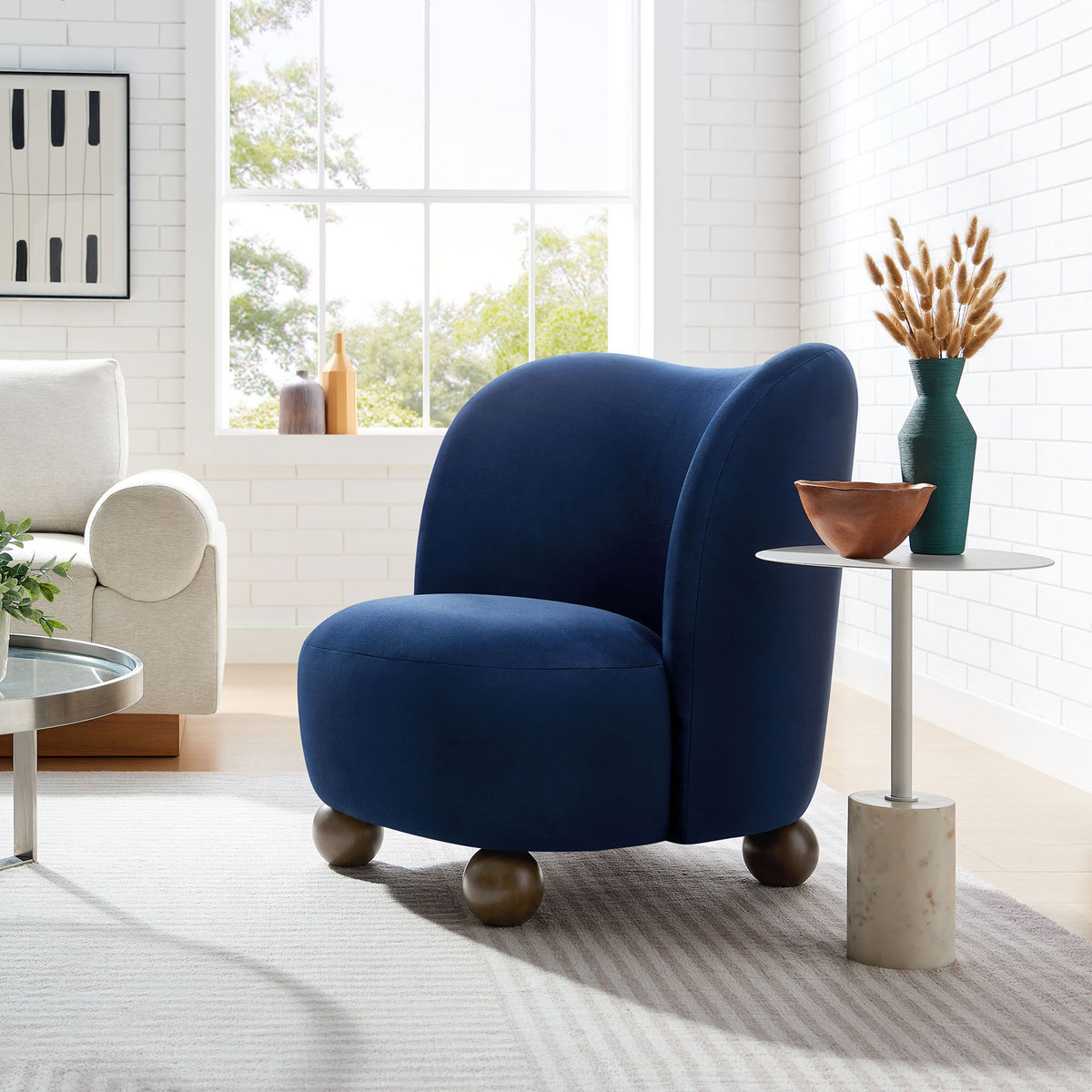 Midnight blue velvet accent chair brings a cozy, modern touch to the living room || EEI-6990-MID-WAL || front_angle_room