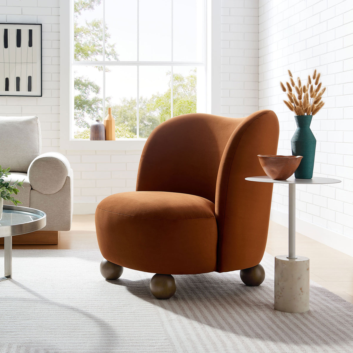 Statement accent chair brings warm rust velvet and sculptural form to the room || EEI-6990-RUS-WAL || front_angle_room
