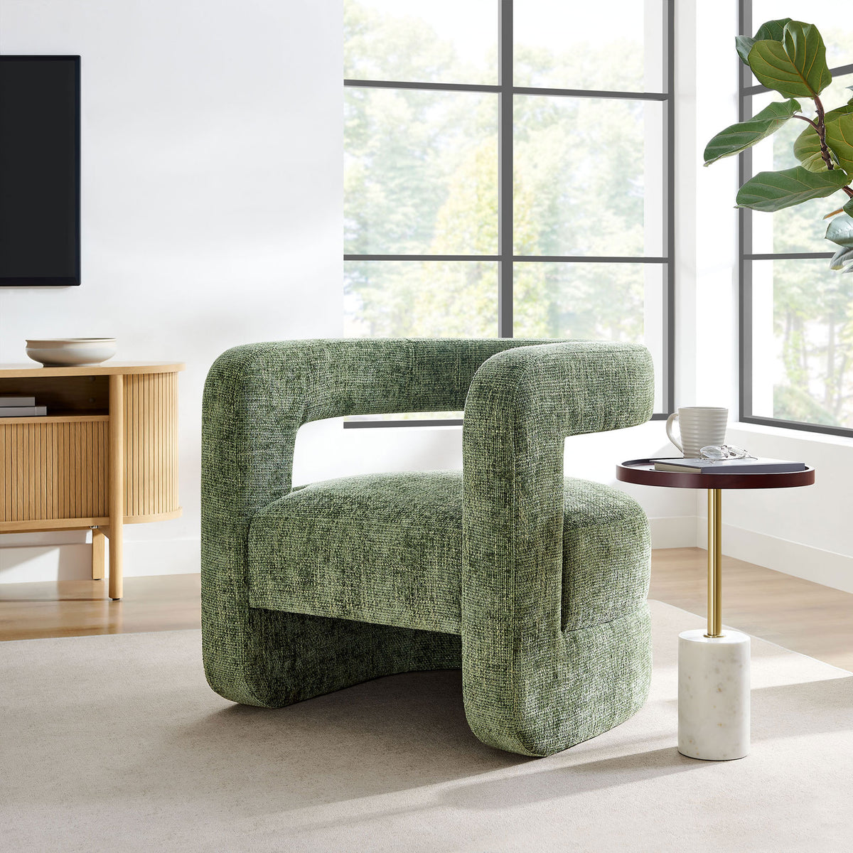 Elevate living spaces with a modern basil green accent chair that pairs sculptural lines with plush seating || EEI-6991-BAS || front_angle_room