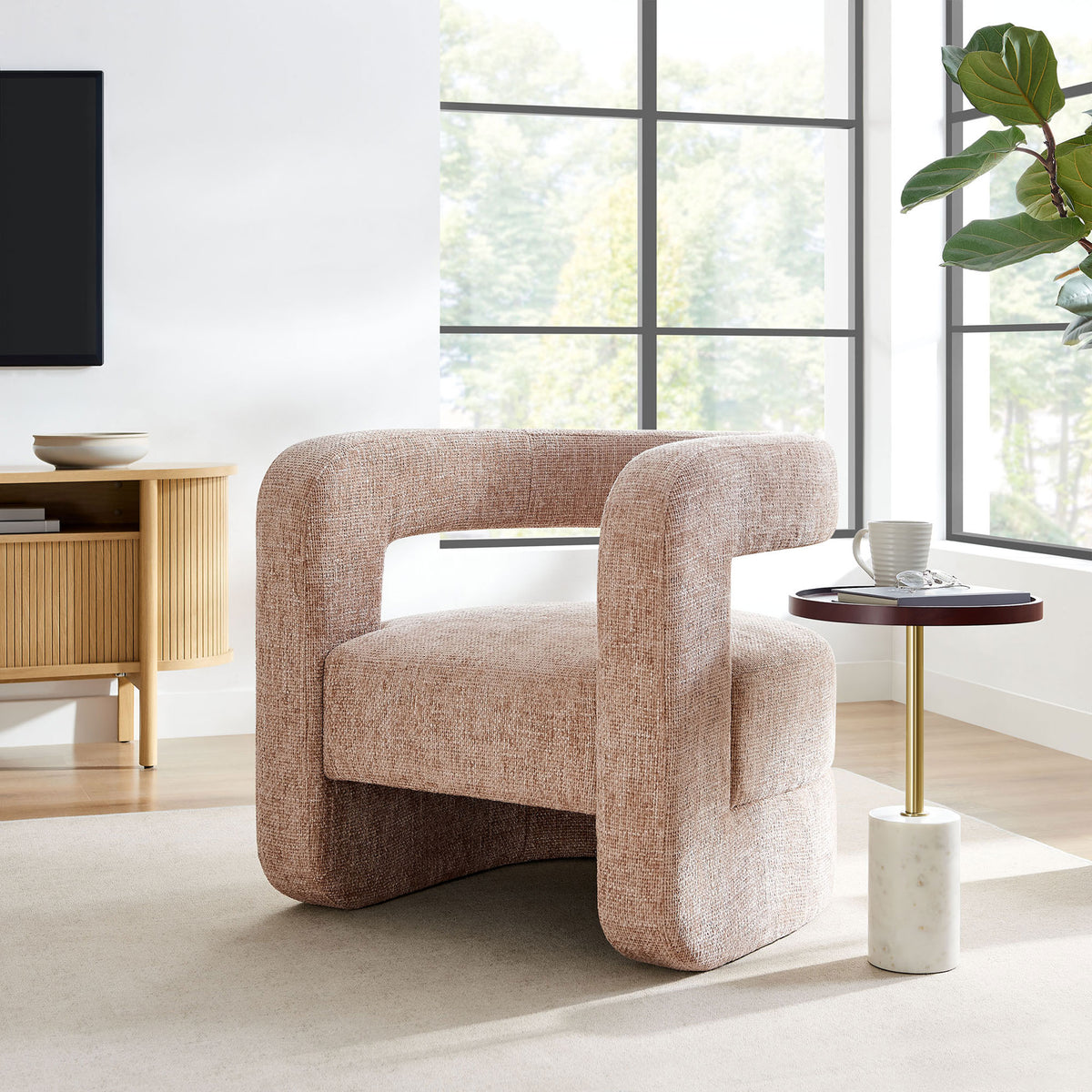 Statement accent chair in blush chenille elevates the room with its sculptural open-back form. || EEI-6991-BLS || front_angle_room