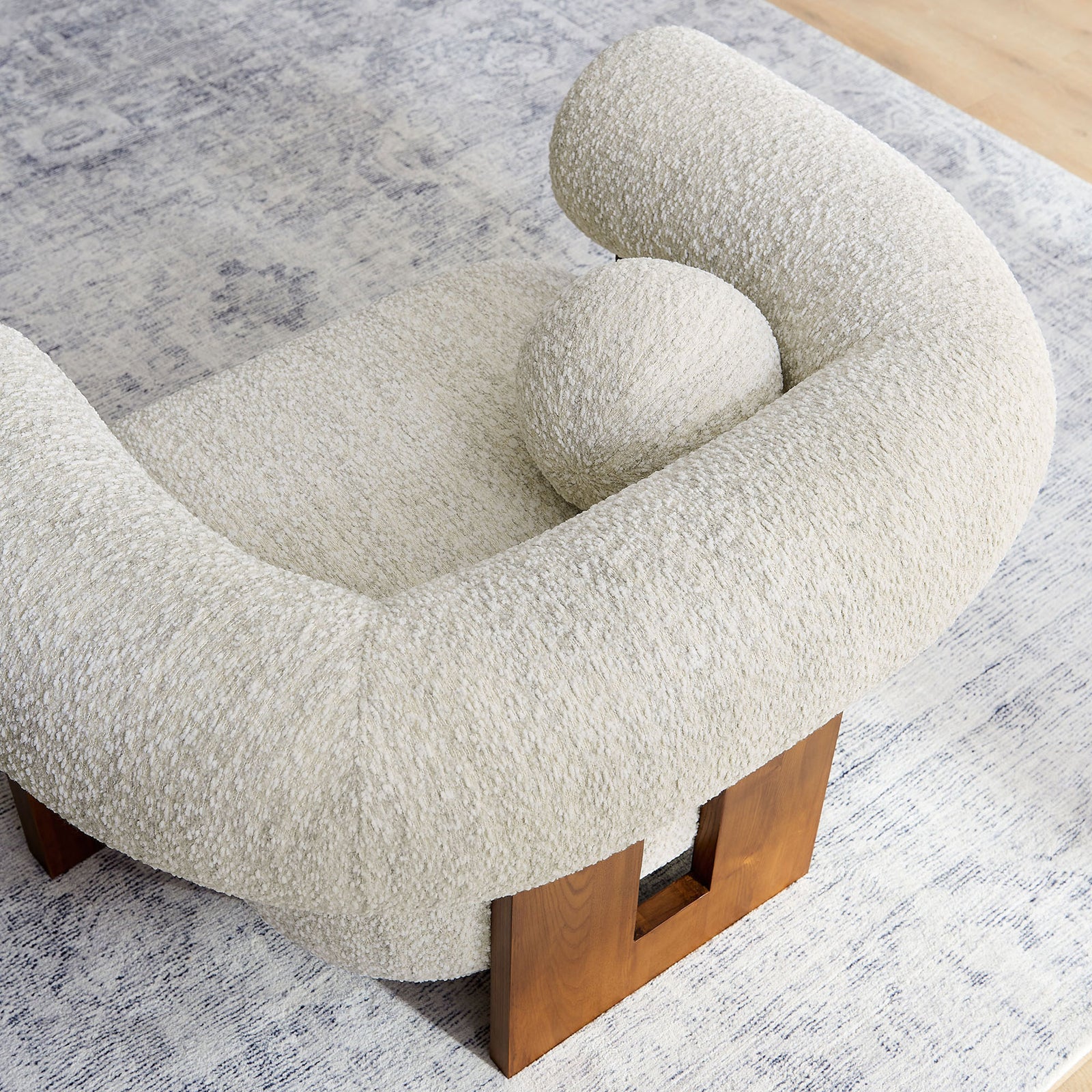 Round pillow nestles into plush contours, emphasizing the chair's enveloping comfort. || EEI-6996-PRL || top_room