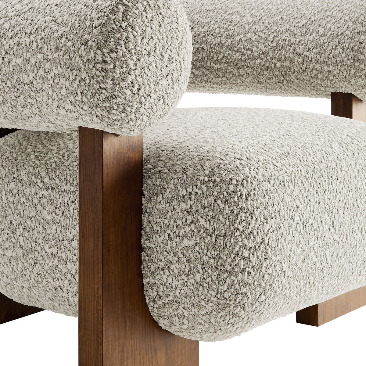Nubby boucle fabric pairs with a smooth ash wood finish for a rich, tactile contrast. || EEI-6996-RIV || detail_studio