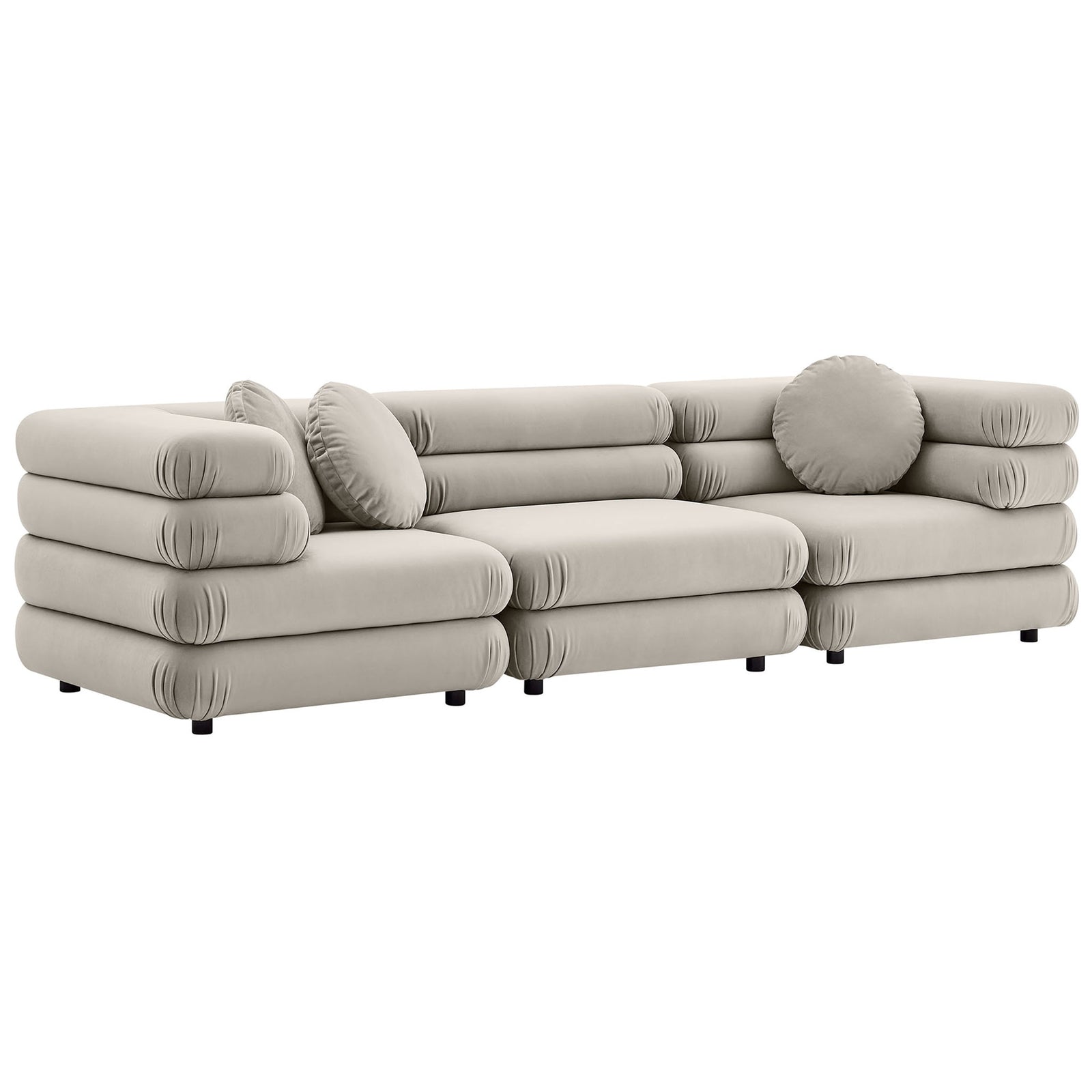 Layered rounded cushions create a sculptural almond velvet sectional with low profile modern lines || EEI-7003-ALM || front_angle_studio