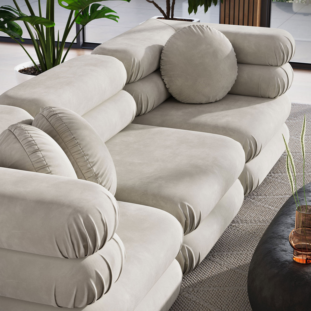 Round accent pillows and deep seats emphasize the plush comfort of the almond velvet sectional || EEI-7003-ALM || detail_room