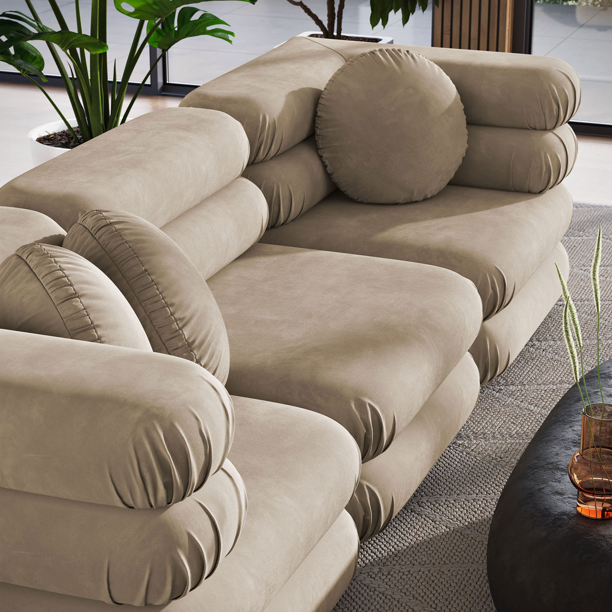 Top view of sectional seating highlighting plush taupe velvet cushions and three matching round throw pillows || EEI-7003-TAU || detail_room