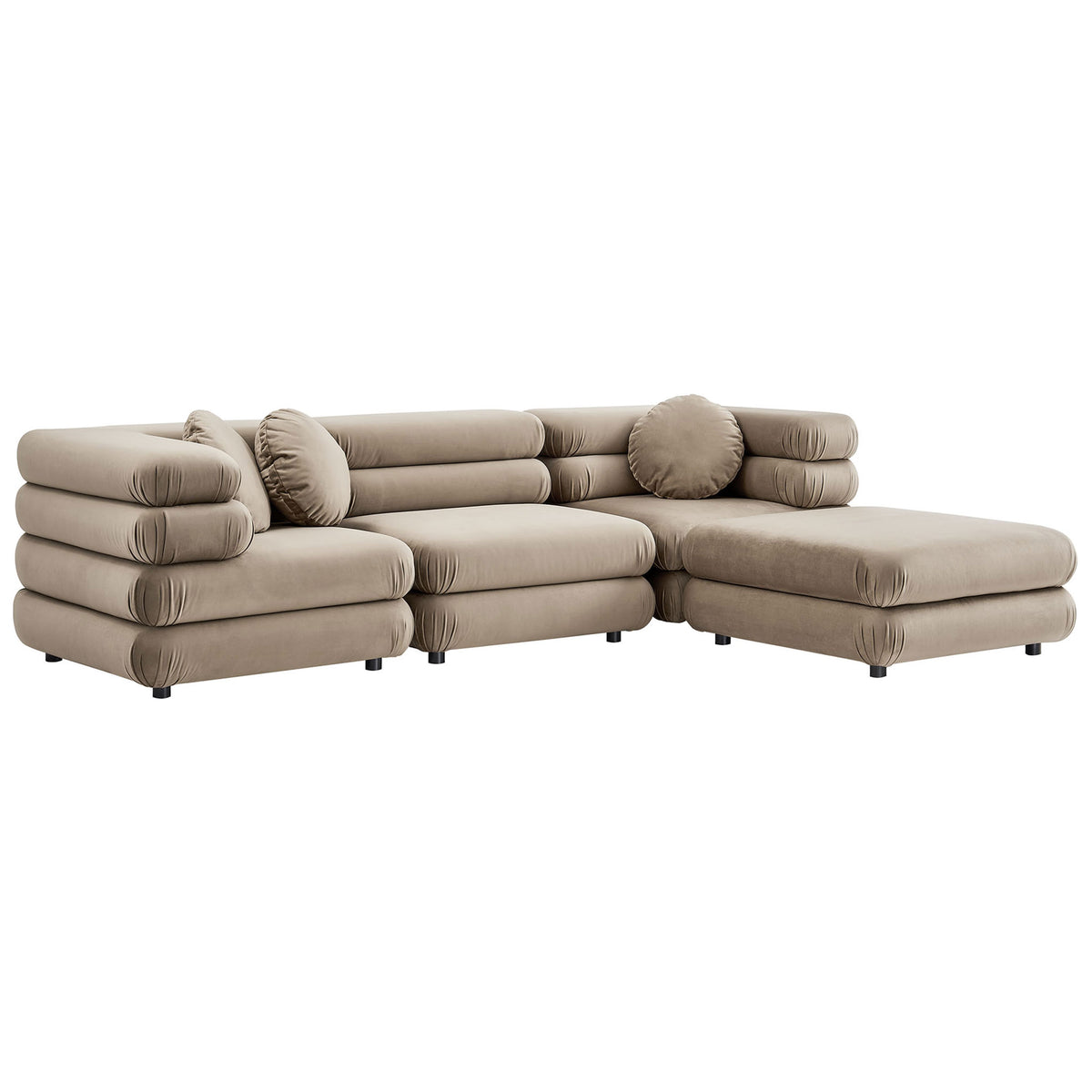 Layered taupe velvet cushions form a modular sectional with ottoman and cozy rounded edges || EEI-7004-TAU || front_angle_studio