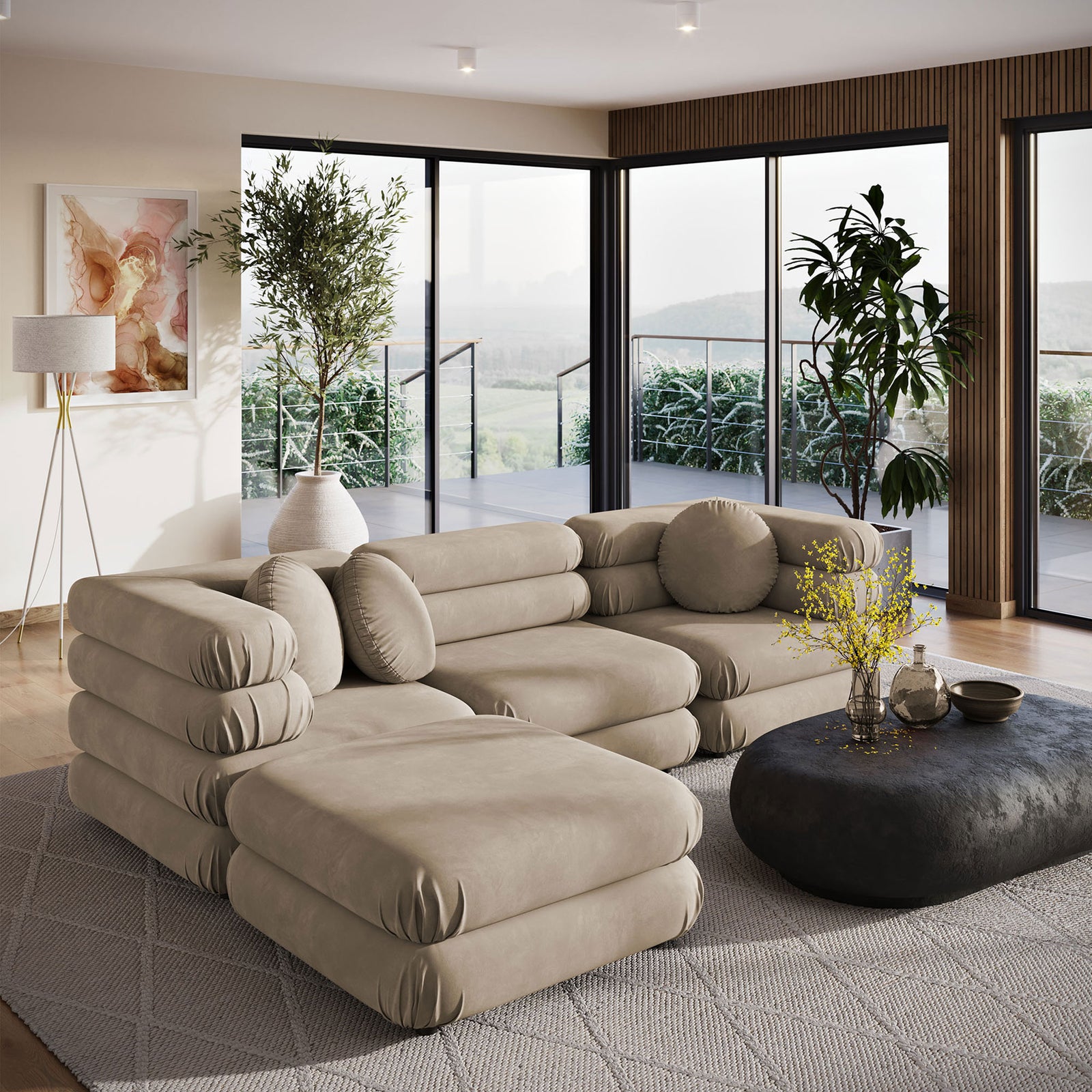 Spacious taupe velvet sectional with ottoman in a modern living room with large windows || EEI-7004-TAU || front_angle_room