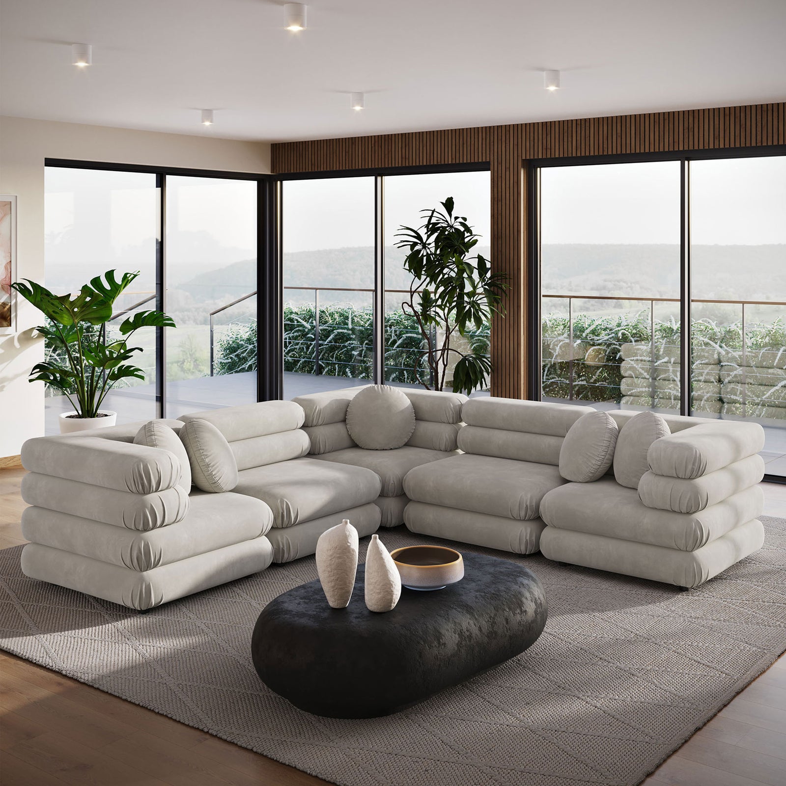 Almond performance velvet sectional sofa in a spacious living room with floor to ceiling windows and round pillows || EEI-7005-ALM || front_angle_room
