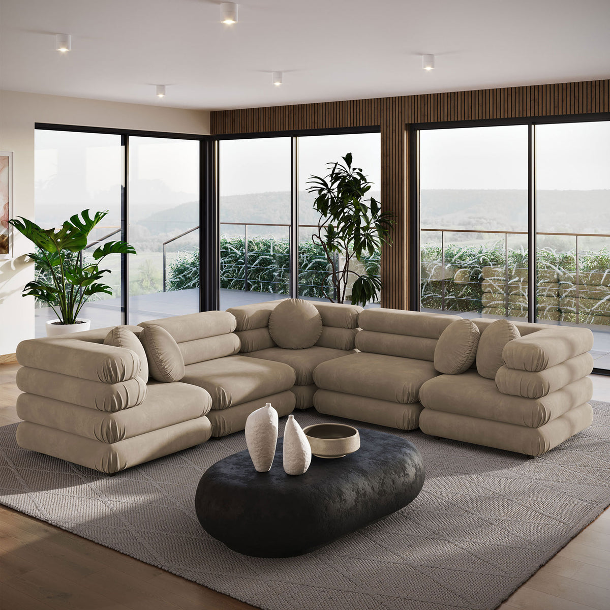 Taupe performance velvet sectional set in a contemporary room with large windows and sculptural coffee table || EEI-7005-TAU || front_angle_room