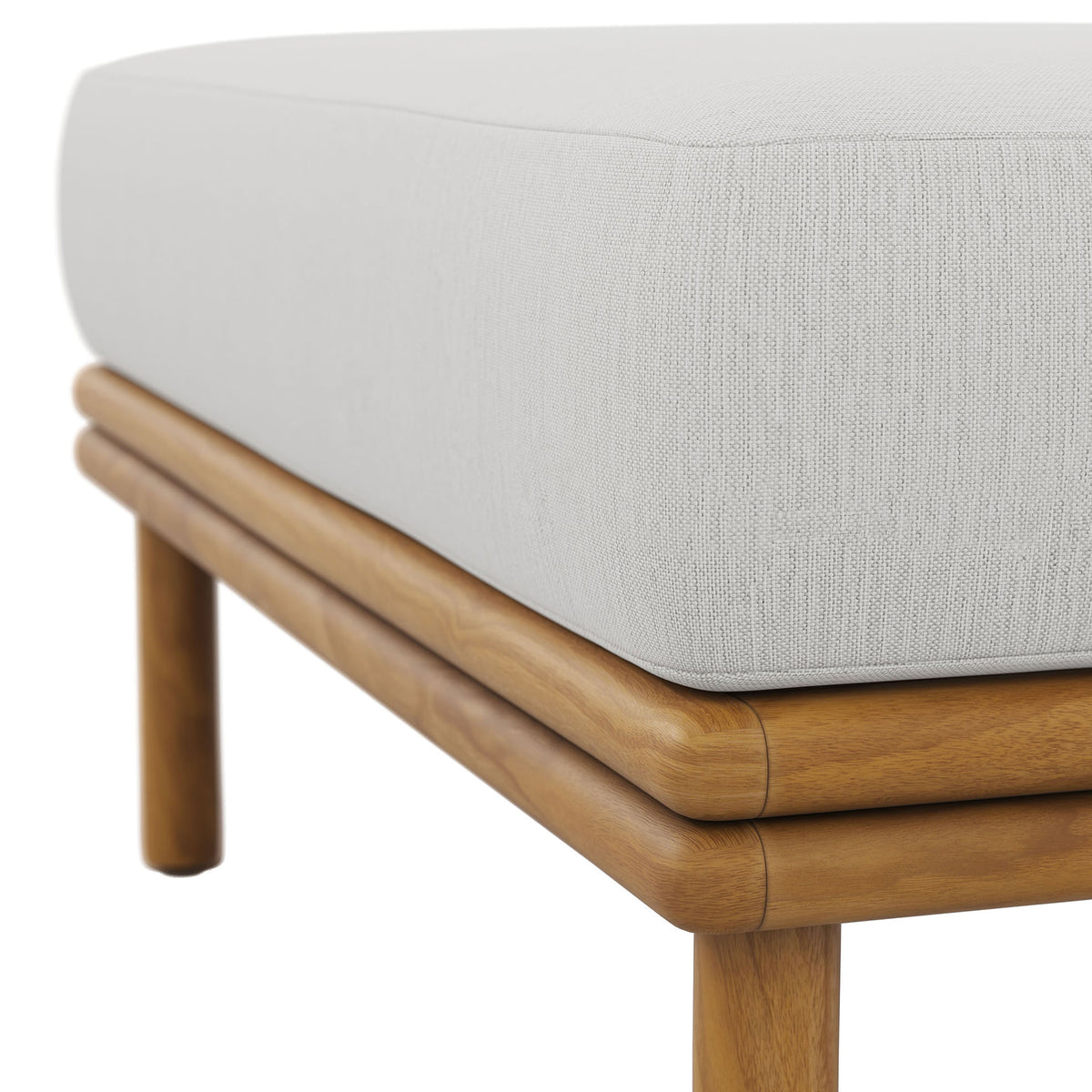 Soft sail-colored fabric and smooth teak joinery highlight the ottoman's refined outdoor craftsmanship. || EEI-7009-NAT-SAI || detail_studio