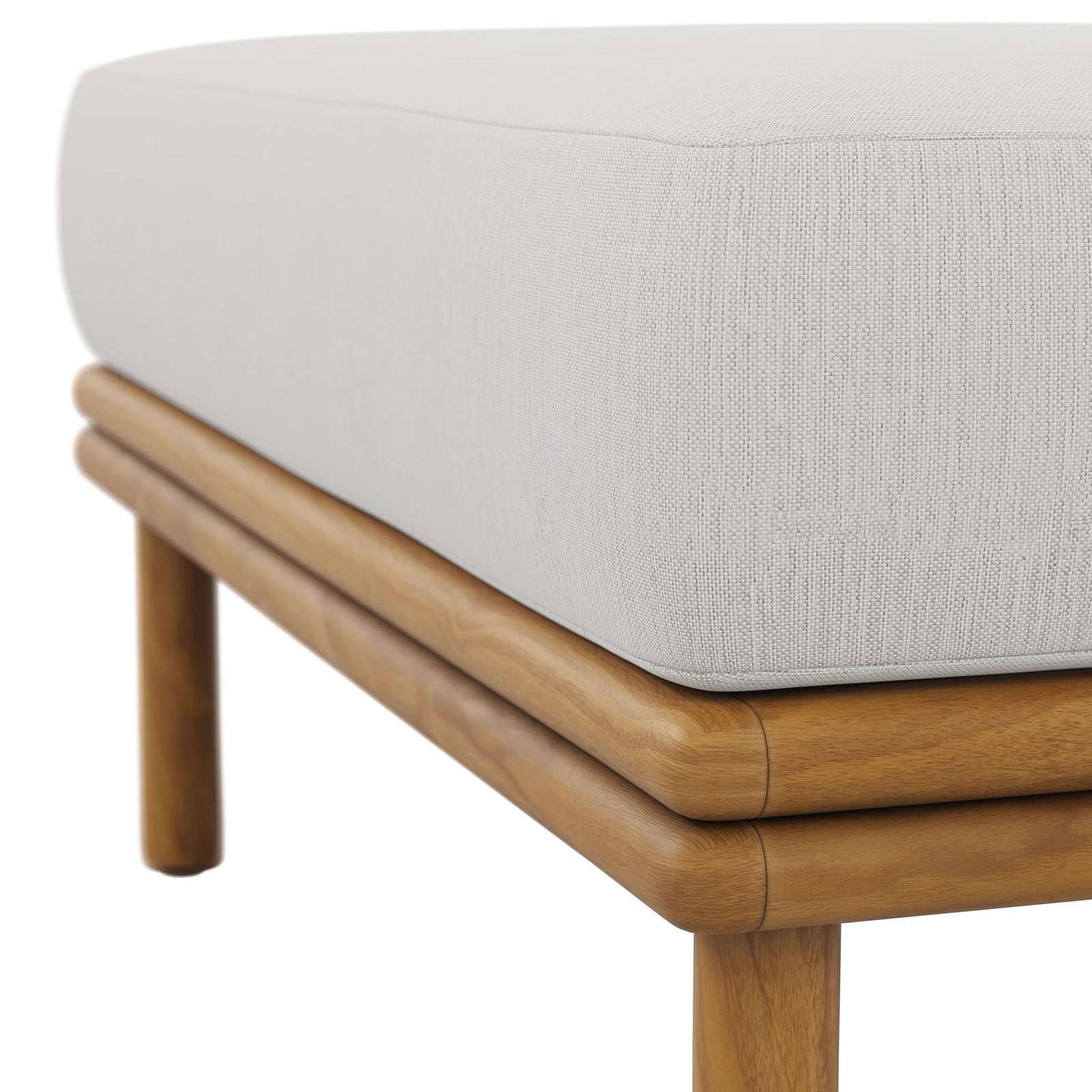 Soft sail-colored fabric and smooth teak joinery highlight the ottoman's refined outdoor craftsmanship. || EEI-7009-NAT-SAI || detail_studio